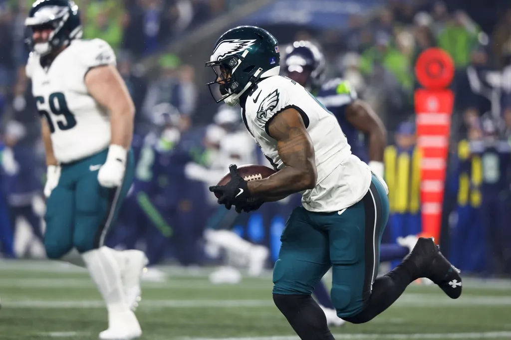 Dec 18, 2023; Seattle, Washington, USA; Philadelphia Eagles running back D'Andre Swift (0) runs for yards after the catch against the Seattle Seahawks during the first quarter at Lumen Field.