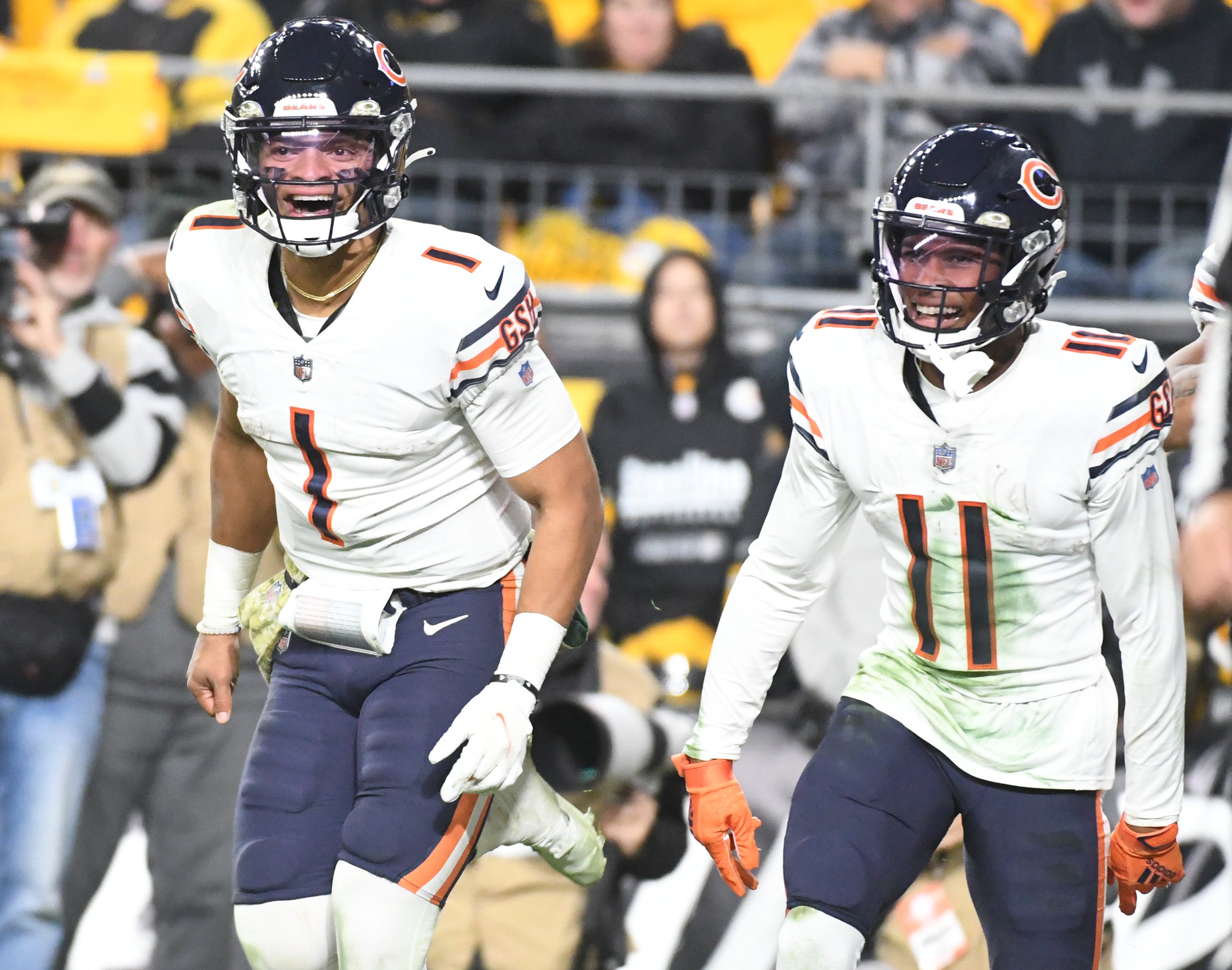 Nov 8, 2021; Pittsburgh, Pennsylvania, USA; Chicago Bears quarterback Justin Fields (1) celebrates a fourth quarter touchdown with wide receiver Darnell Mooney (11) against the Pittsburgh Steelers at Heinz Field.