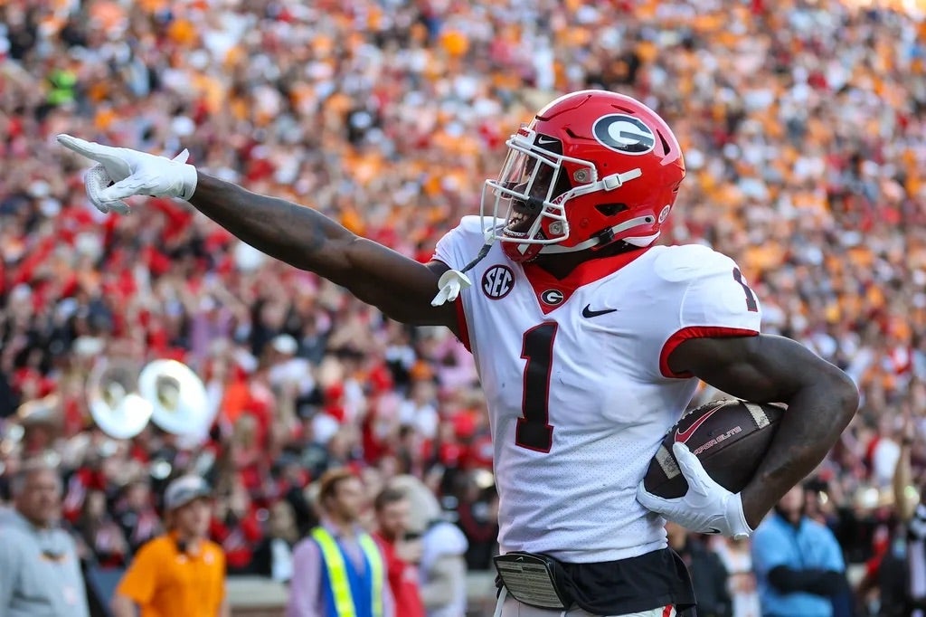 Georgia Bulldogs wide receiver Marcus Rosemy-Jacksaint (1) reacts after catching a touchdown pass against the Tennessee Volunteers during the first half at Neyland Stadium.