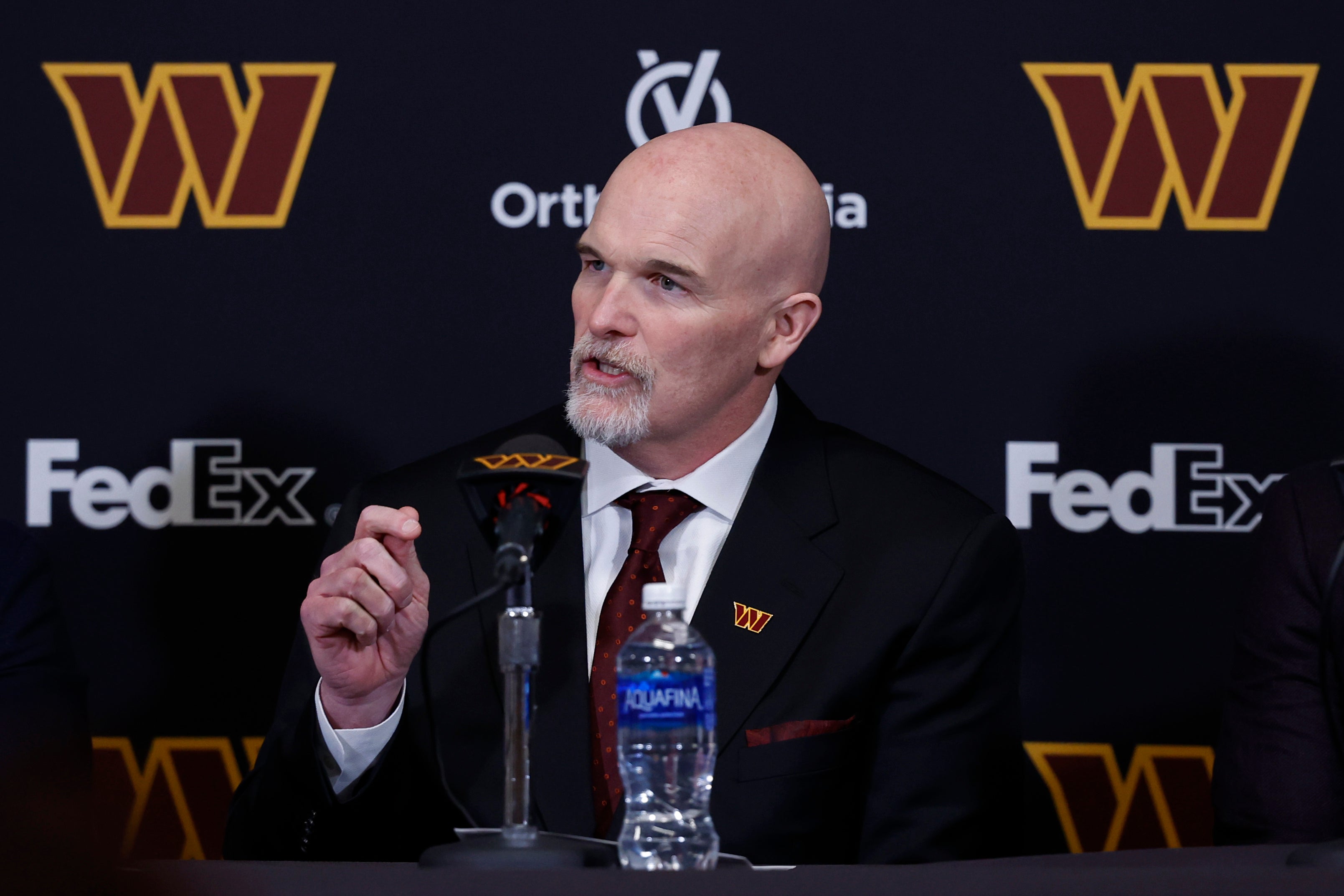Washington Commanders head coach Dan Quinn speaks at his introductory press conference at Commanders Park.