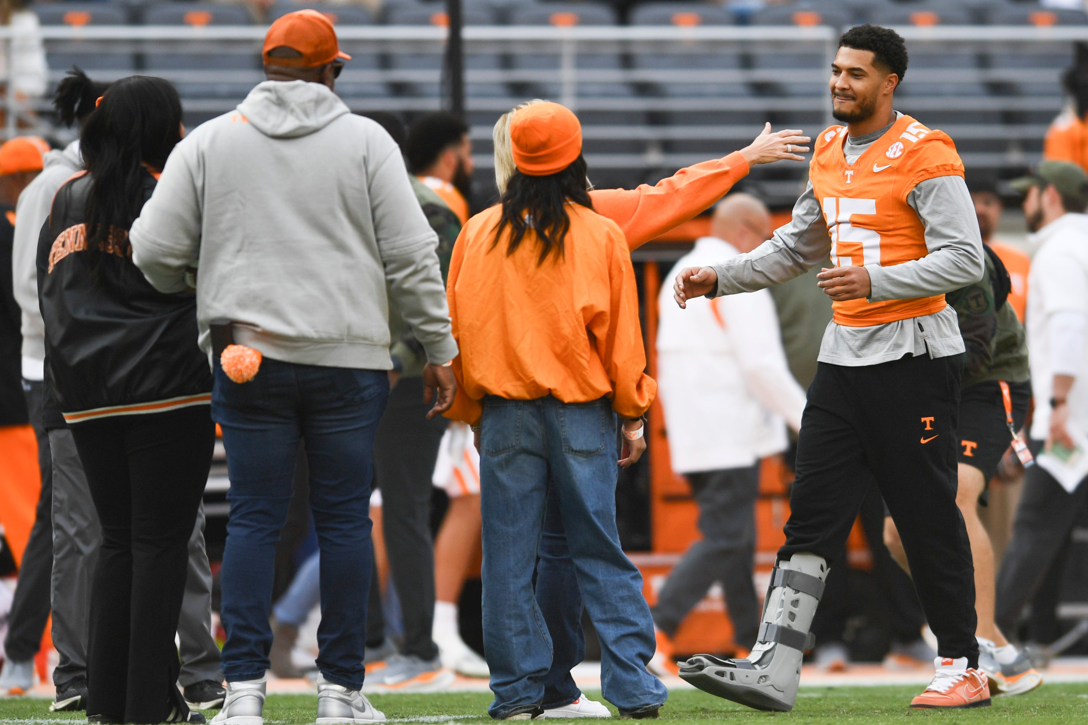 Tennessee wide receiver Bru McCoy (15) hugs family during Senior Day celebrations before a football game between Tennessee and Vanderbilt at Neyland Stadium in Knoxville, Tenn., on Saturday, Nov. 25, 2023.