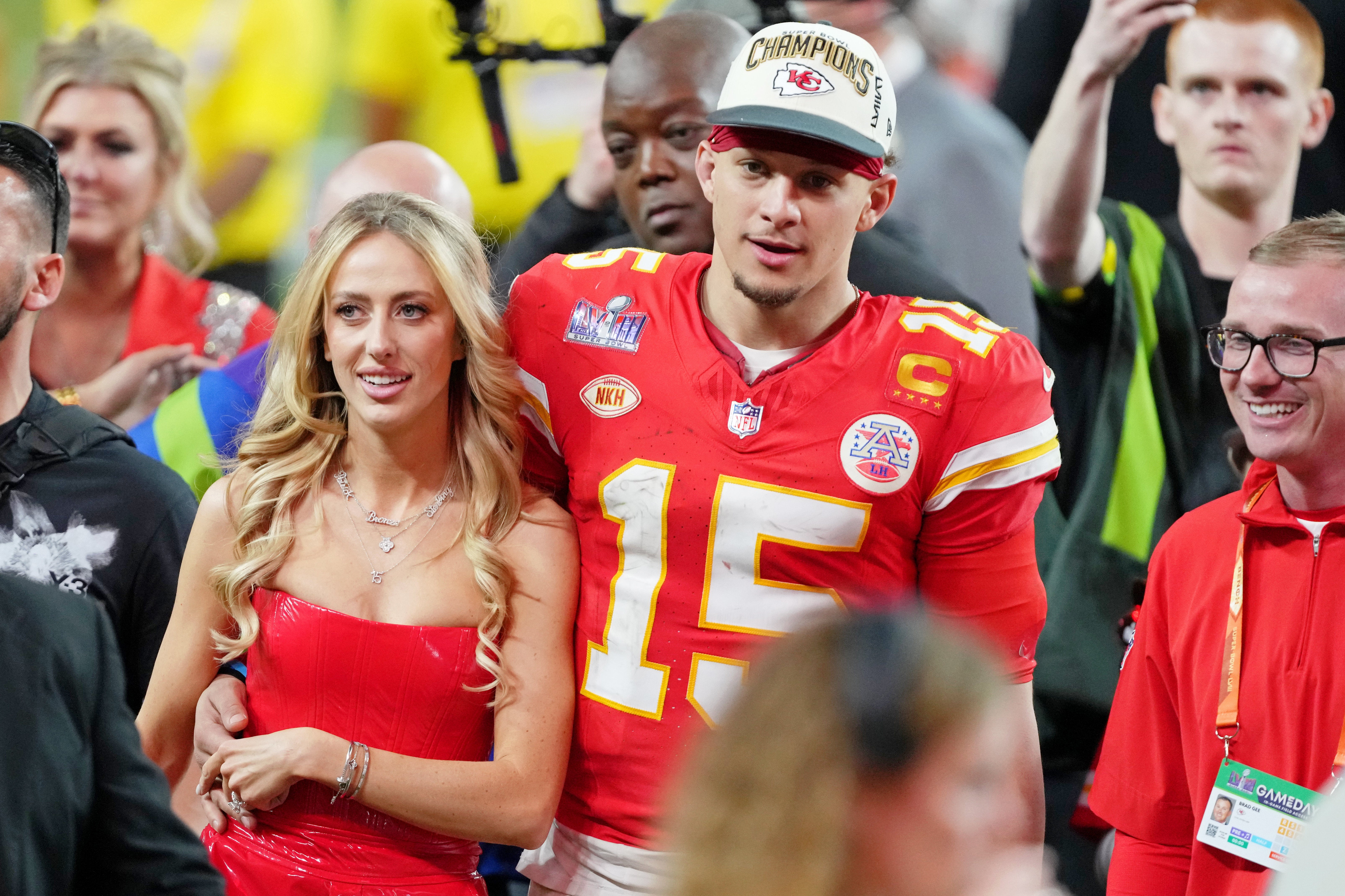 Feb 11, 2024; Paradise, Nevada, USA; Kansas City Chiefs quarterback Patrick Mahomes (15) and his wife Brittany Mahomes walk off the field after winning Super Bowl LVIII against the San Francisco 49ers at Allegiant Stadium.
