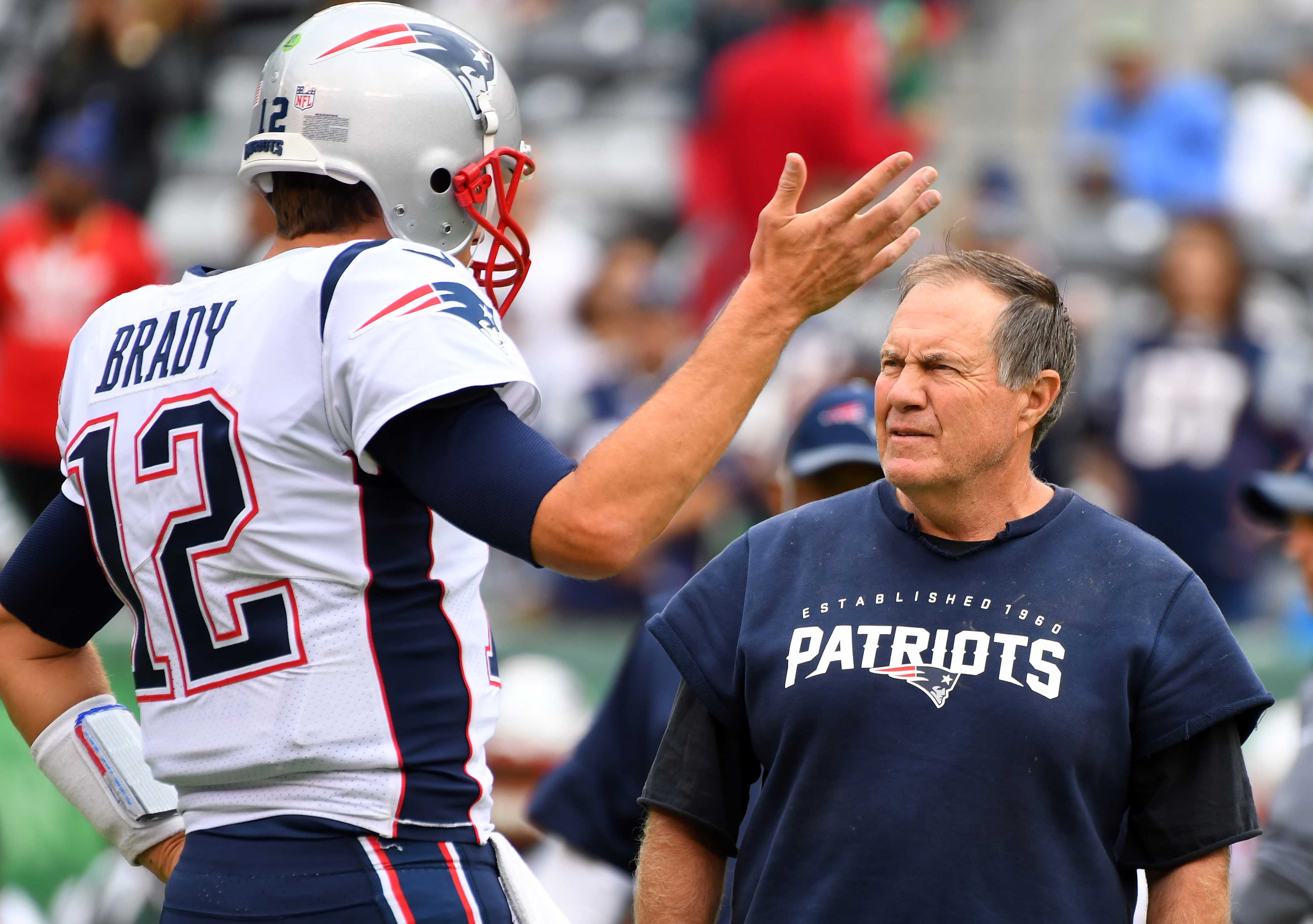 Oct 15, 2017; East Rutherford, NJ, USA; New England Patriots head coach Bill Belichick and quarterback Tom Brady (12) before the game against The New York Jets at MetLife Stadium