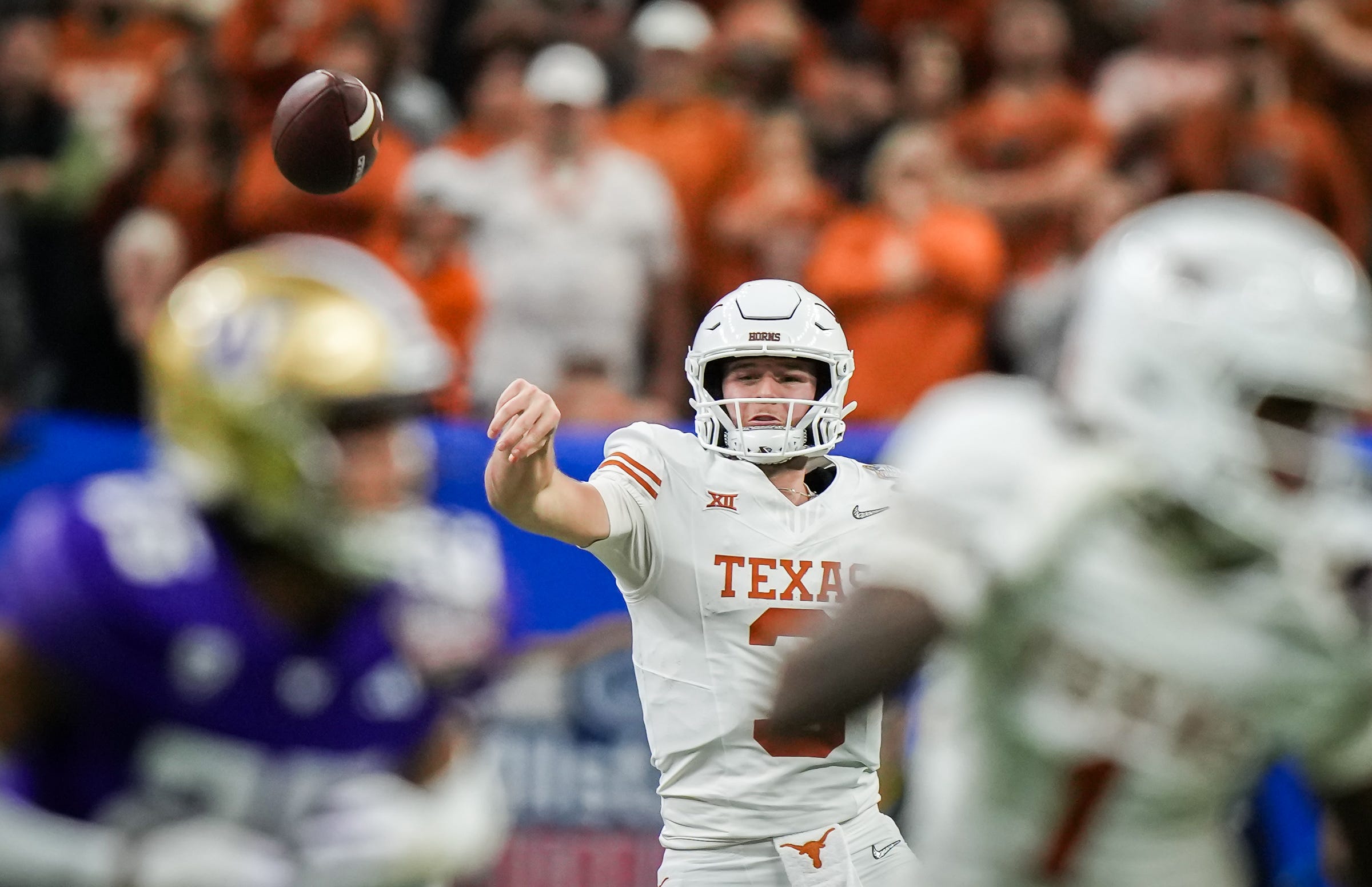 Texas Longhorns quarterback Quinn Ewers (3) sends a pass down the field during the Sugar Bowl College Football Playoff semi-finals at the Ceasars Superdome in New Orleans, Louisiana, Jan. 1, 2024. The Huskies won the game over the Texas Longhorns 37-31.