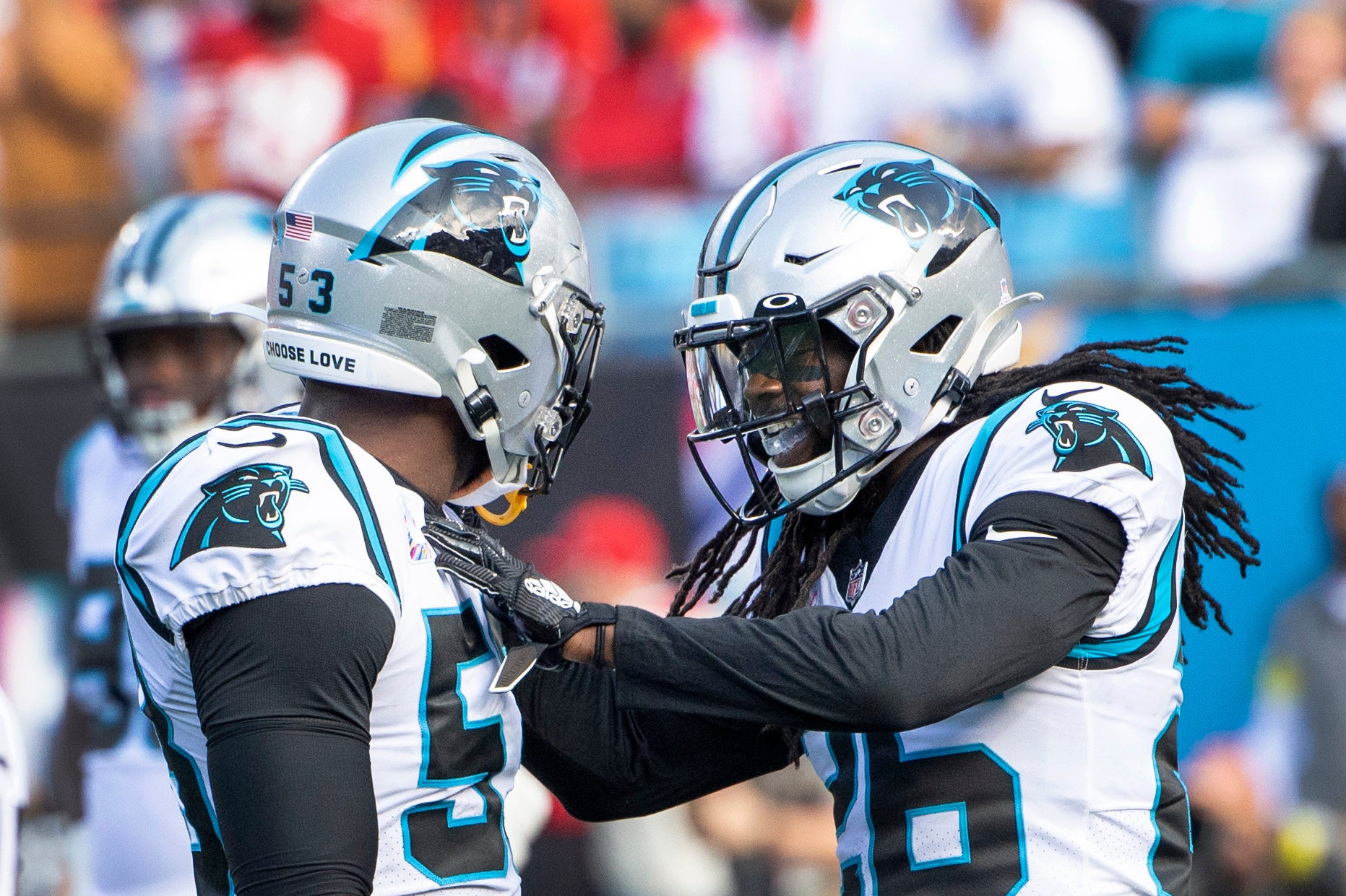 Oct 9, 2022; Charlotte, North Carolina, USA; Carolina Panthers defensive end Brian Burns (53) reacts with cornerback Donte Jackson (26) in the second quarter at Bank of America Stadium. Mandatory Credit: Bob Donnan-USA TODAY Sports