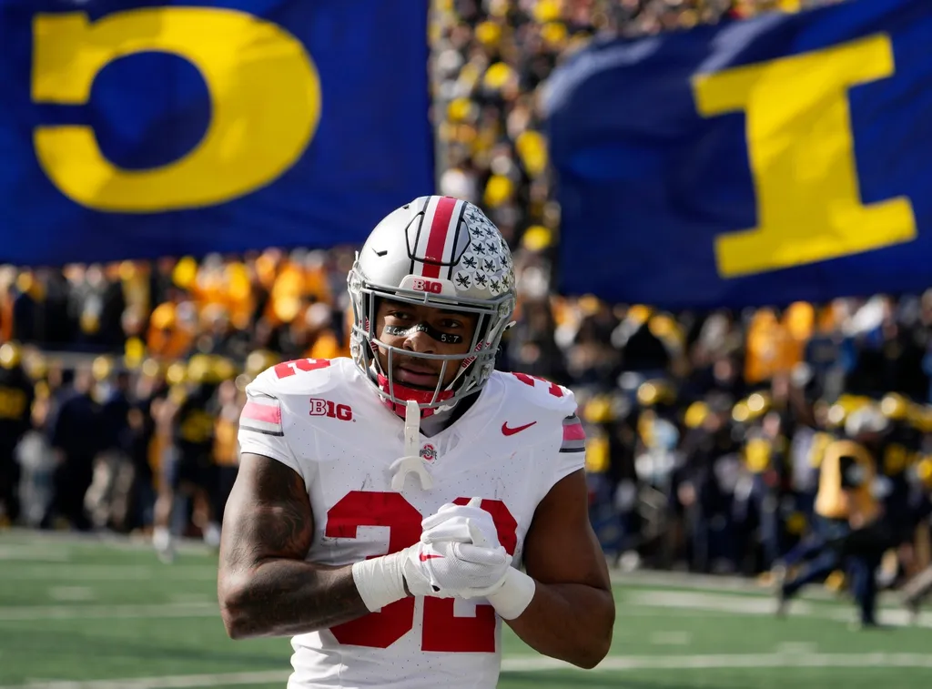 Ohio State Buckeyes running back TreVeyon Henderson (32) take the field before Saturday's NCAA Division I football game against the Michigan Wolverines at Michigan Stadium.
