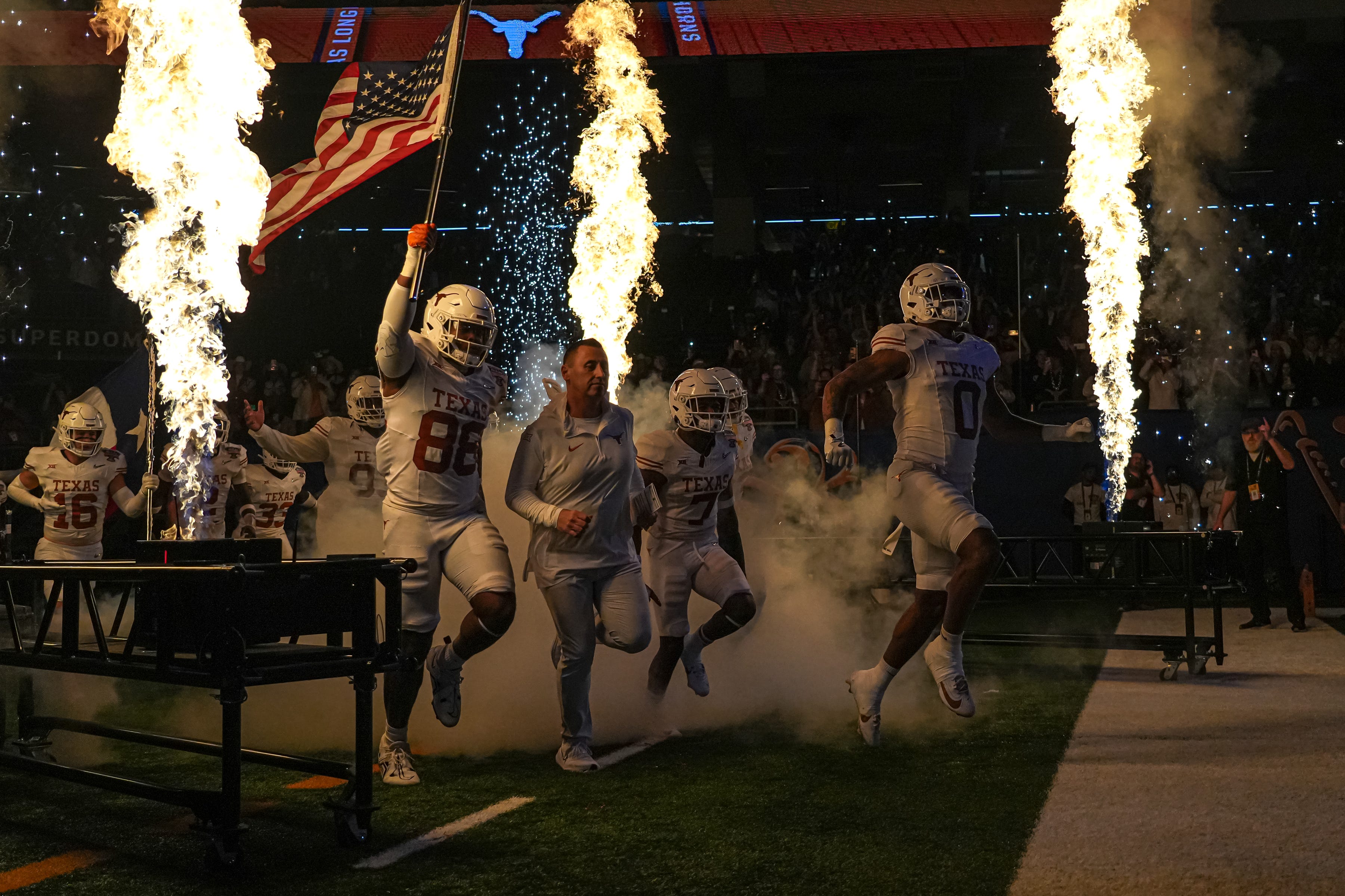 Texas Longhorns head coach Steve Sarkisian leads his team onto the field for the Sugar Bowl College Football Playoff semifinals game against the Washington Huskies at the Caesars Superdome on Monday, Jan. 1, 2024 in New Orleans, Louisiana.
