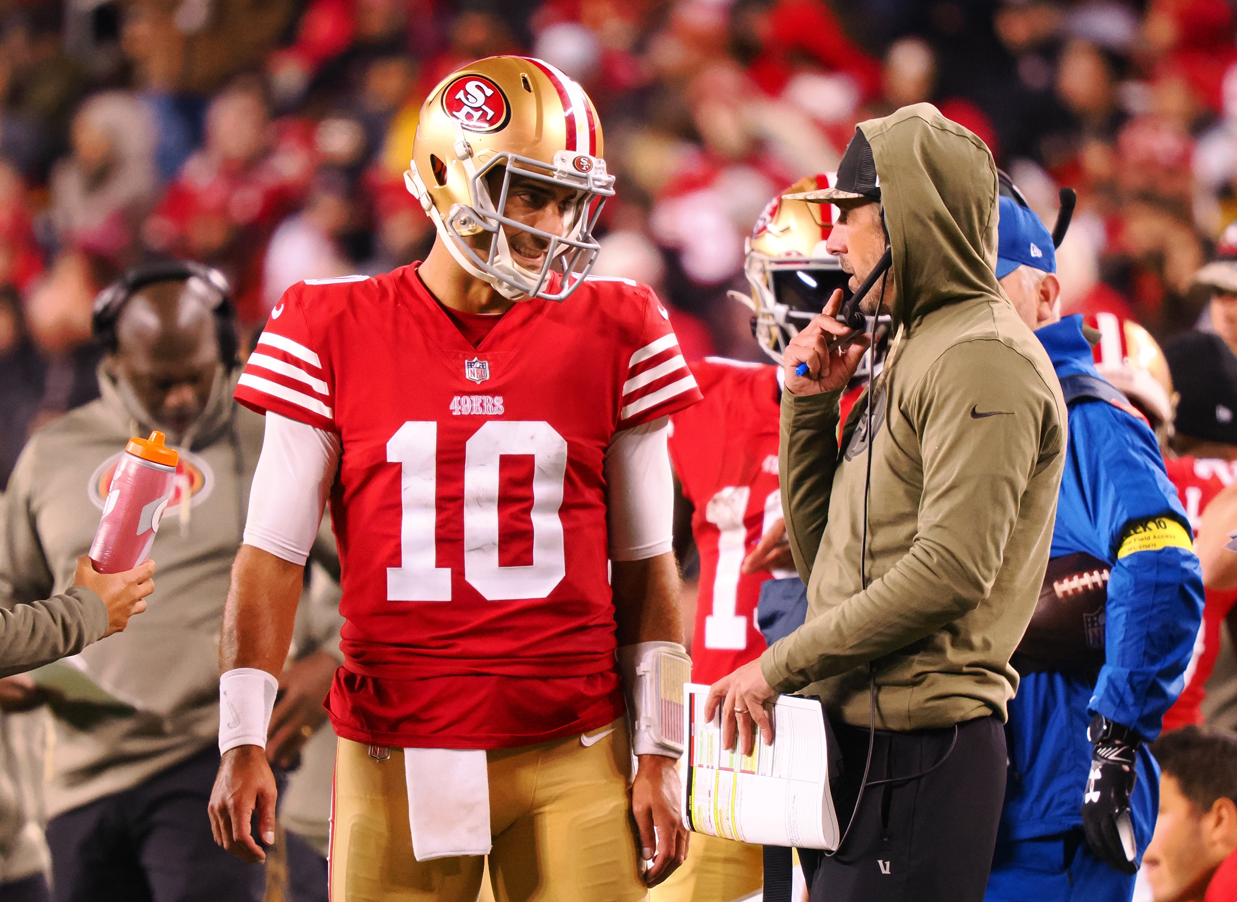 Nov 13, 2022; Santa Clara, California, USA; San Francisco 49ers quarterback Jimmy Garoppolo (10) speaks with head coach Kyle Shanahan on the sideline during the fourth quarter against the Los Angeles Chargers at Levi's Stadium.