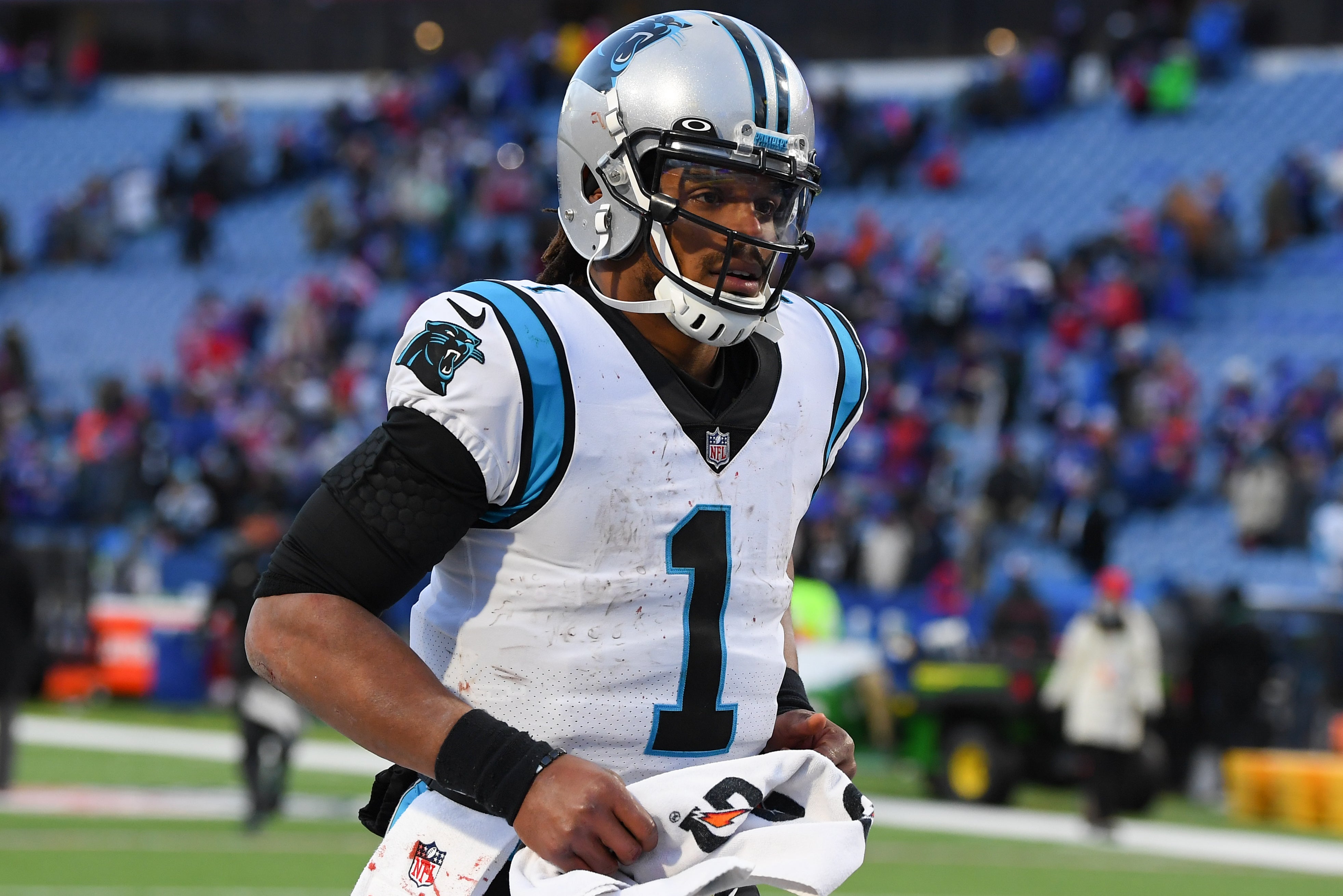 Dec 19, 2021; Orchard Park, New York, USA; Carolina Panthers quarterback Cam Newton (1) jogs off the field following the game against the Buffalo Bills at Highmark Stadium. Mandatory Credit: Rich Barnes-USA TODAY Sports