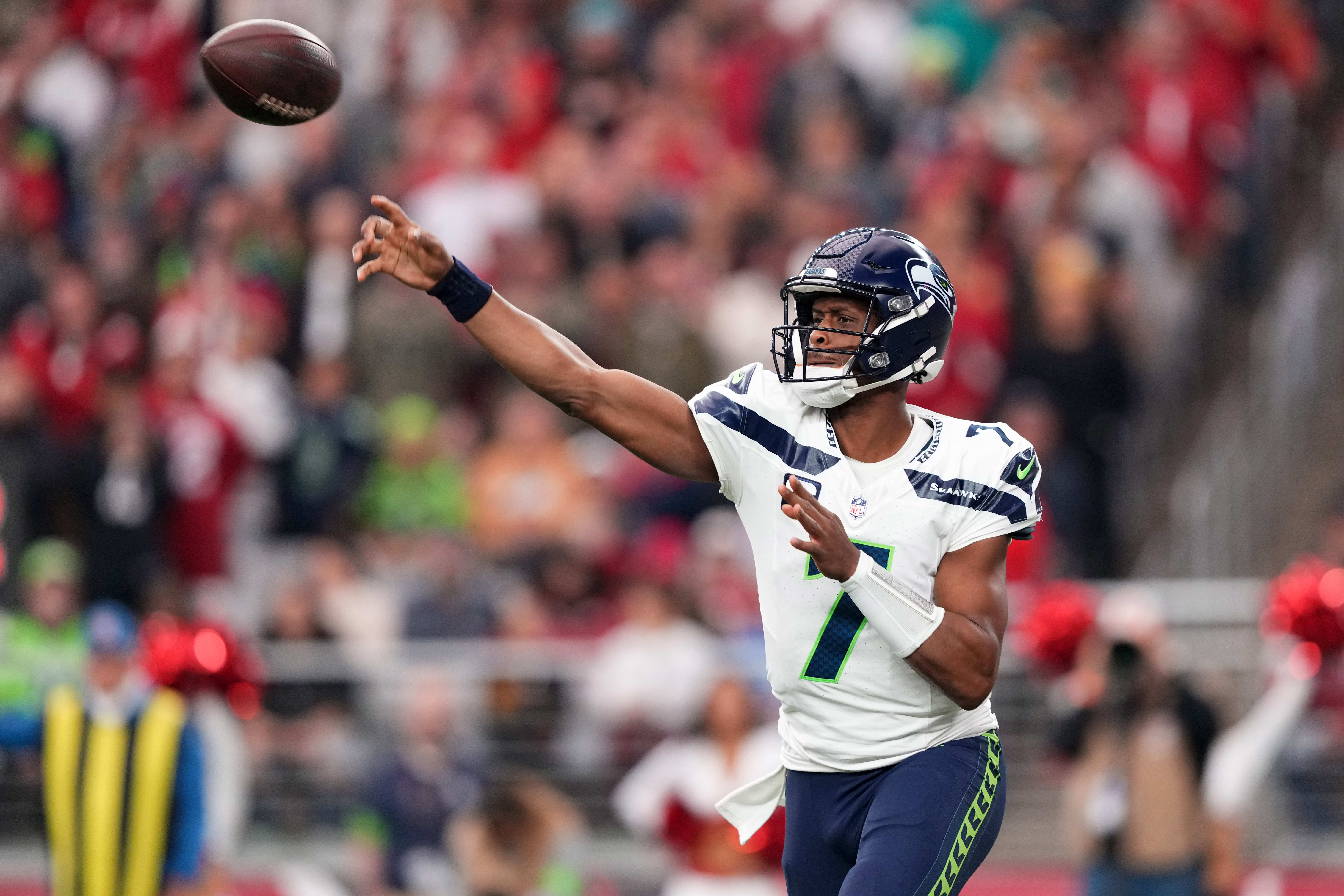 Jan 7, 2024; Glendale, Arizona, USA; Seattle Seahawks quarterback Geno Smith (7) throws a pass against the Arizona Cardinals during the first half at State Farm Stadium.