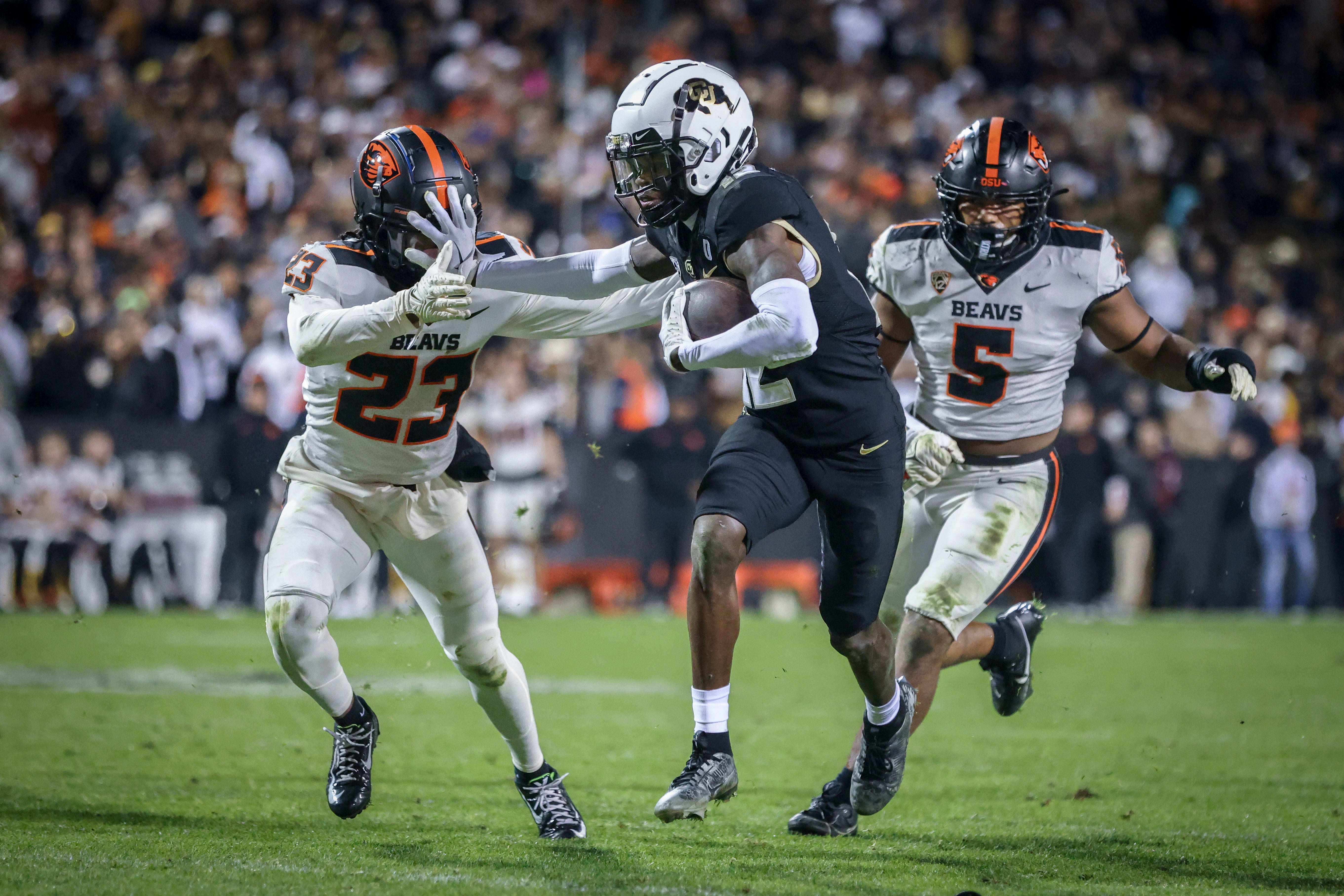 Colorado Buffaloes cornerback Travis Hunter (12) breaks past Oregon State Beavers defensive back Jermod McCoy (23) at Folsom Field.