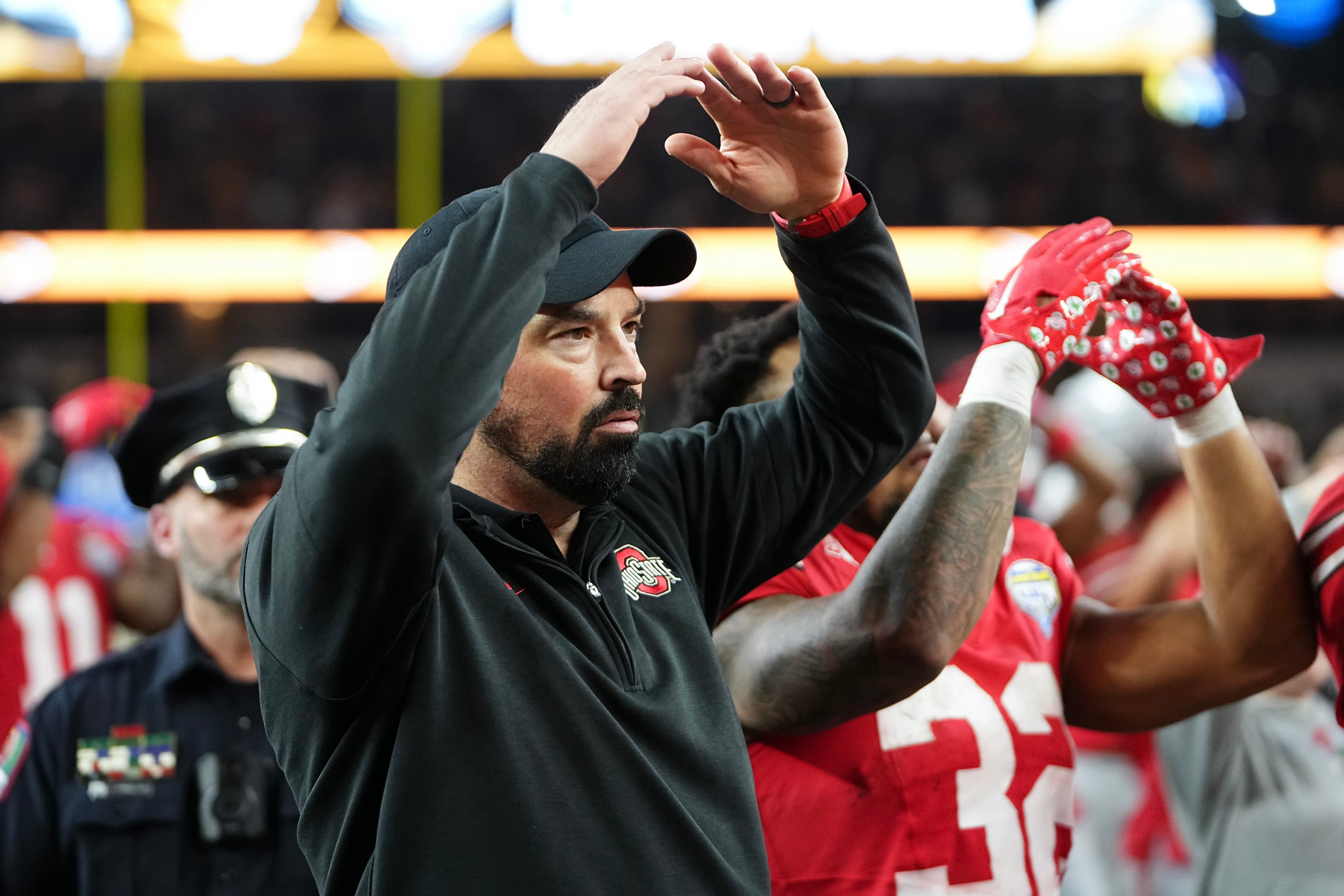 Dec 29, 2023; Arlington, Texas, USA; Ohio State Buckeyes head coach Ryan Day sings Carmen Ohio following the 14-3 loss to the Missouri Tigers in the Goodyear Cotton Bowl Classic at AT&T Stadium.