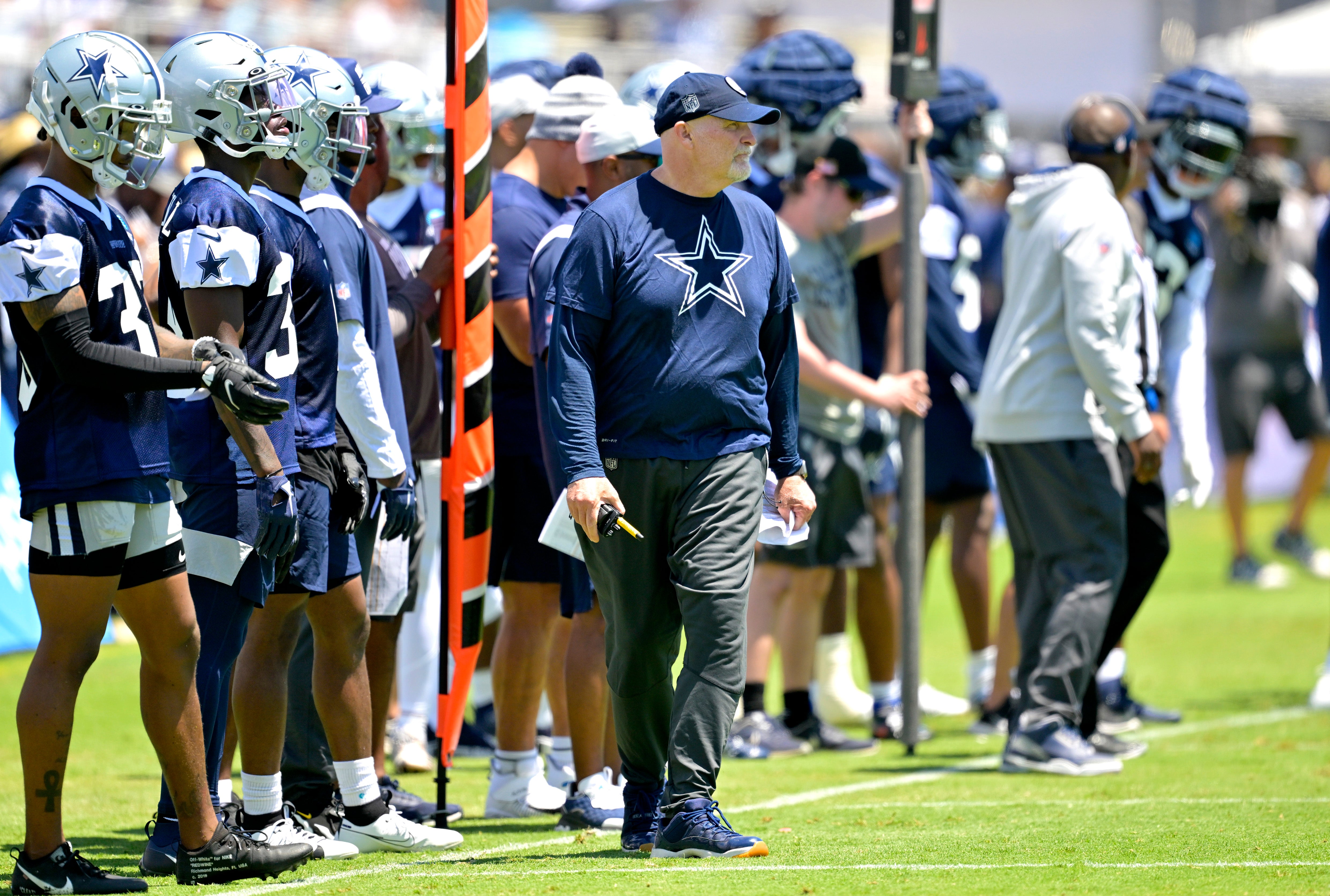 Dallas Cowboys offensive coordinator Dan Quinn watches over training camp drills at River Ridge Playing Fields in Oxnard, CA.