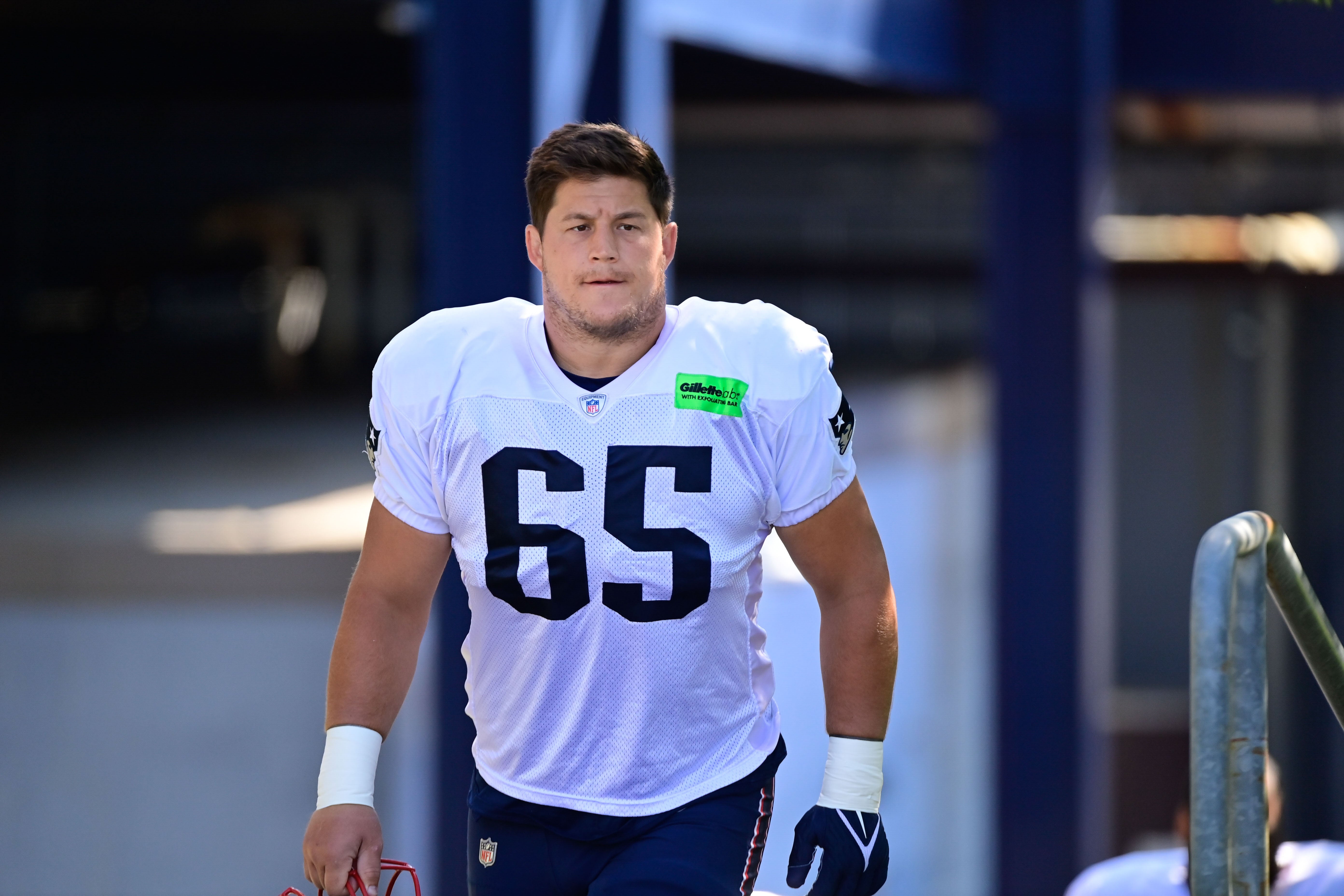 Aug 2, 2023; Foxborough, MA, USA; New England Patriots guard James Ferentz (65) heads to the practice fields at Gillette Stadium