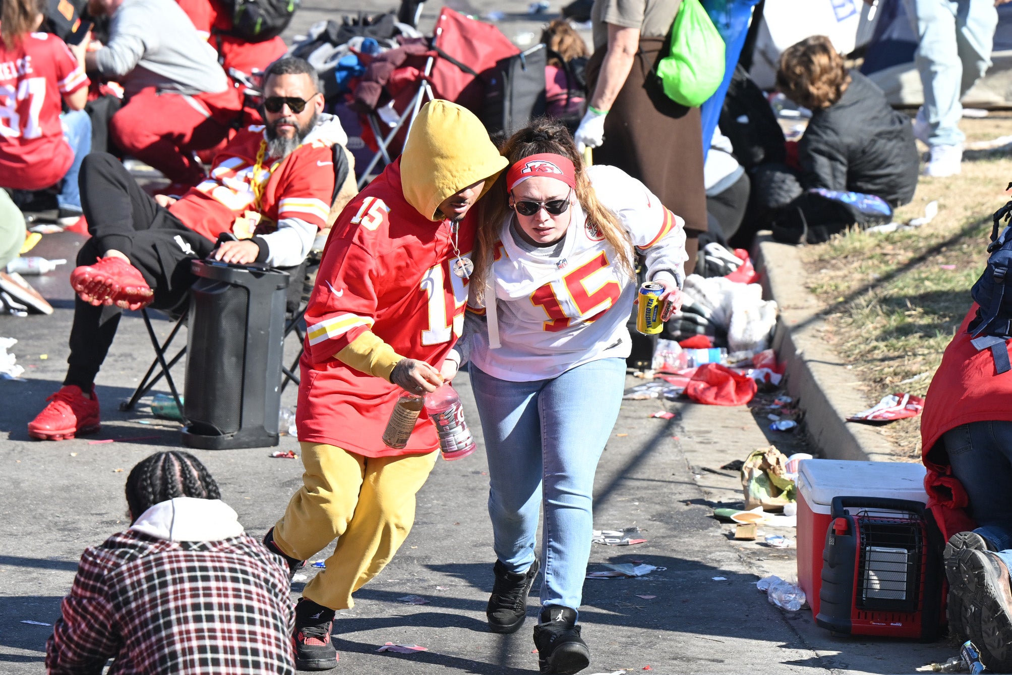 Feb 14, 2024; Kansas City, MO, USA; Fans leave the area after shots were fired after the celebration of the Kansas City Chiefs winning Super Bowl LVIII. 