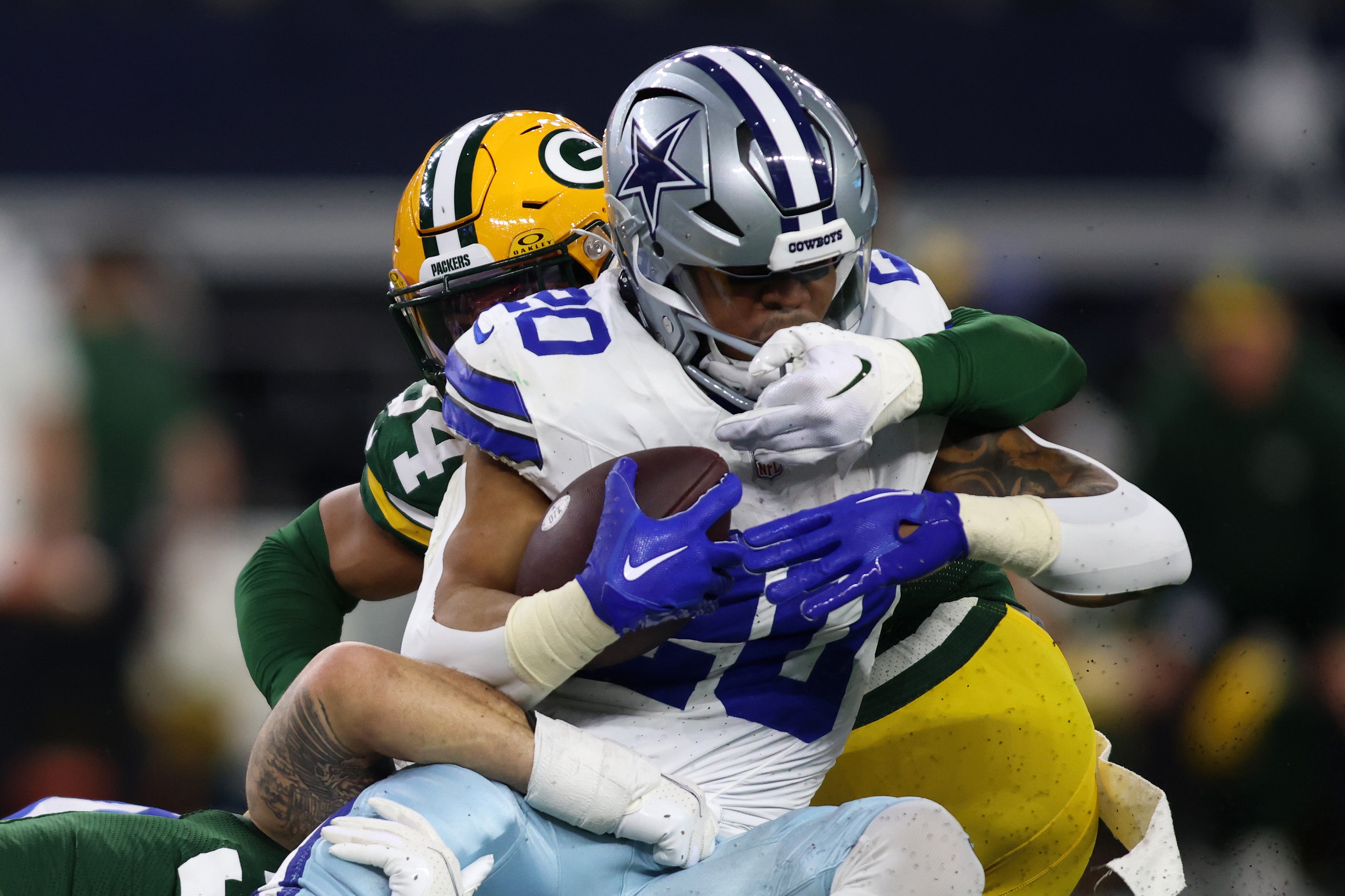 Dallas Cowboys running back Tony Pollard (20) rushes the ball against the Green Bay Packers during the first half for the 2024 NFC wild card game at AT&T Stadium.