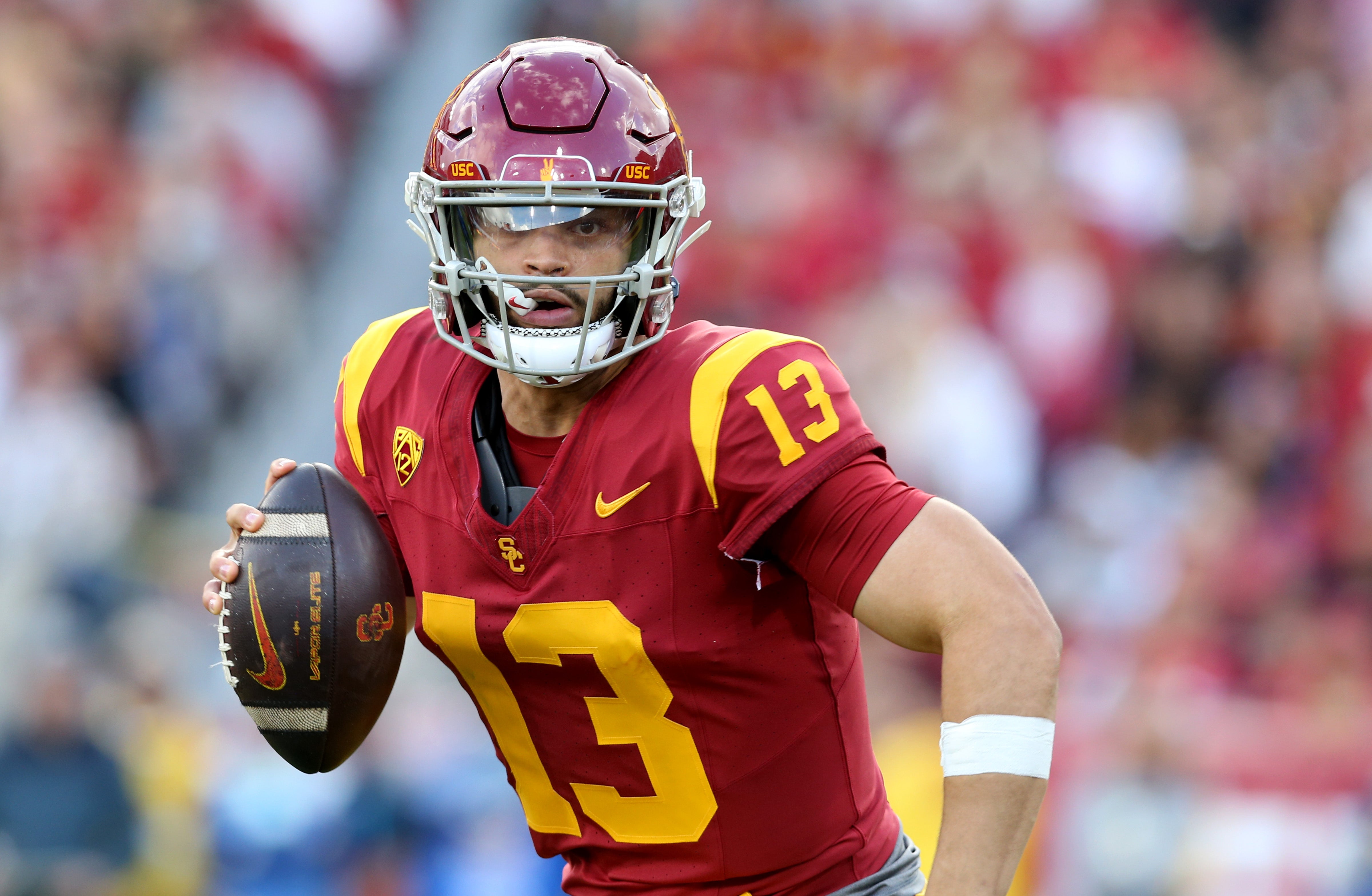 Nov 18, 2023; Los Angeles, California, USA; USC Trojans quarterback Caleb Williams (13) scrambles during the second quarter against the UCLA Bruins at United Airlines Field at Los Angeles Memorial Coliseum. Mandatory Credit: Jason Parkhurst-USA TODAY Sports
