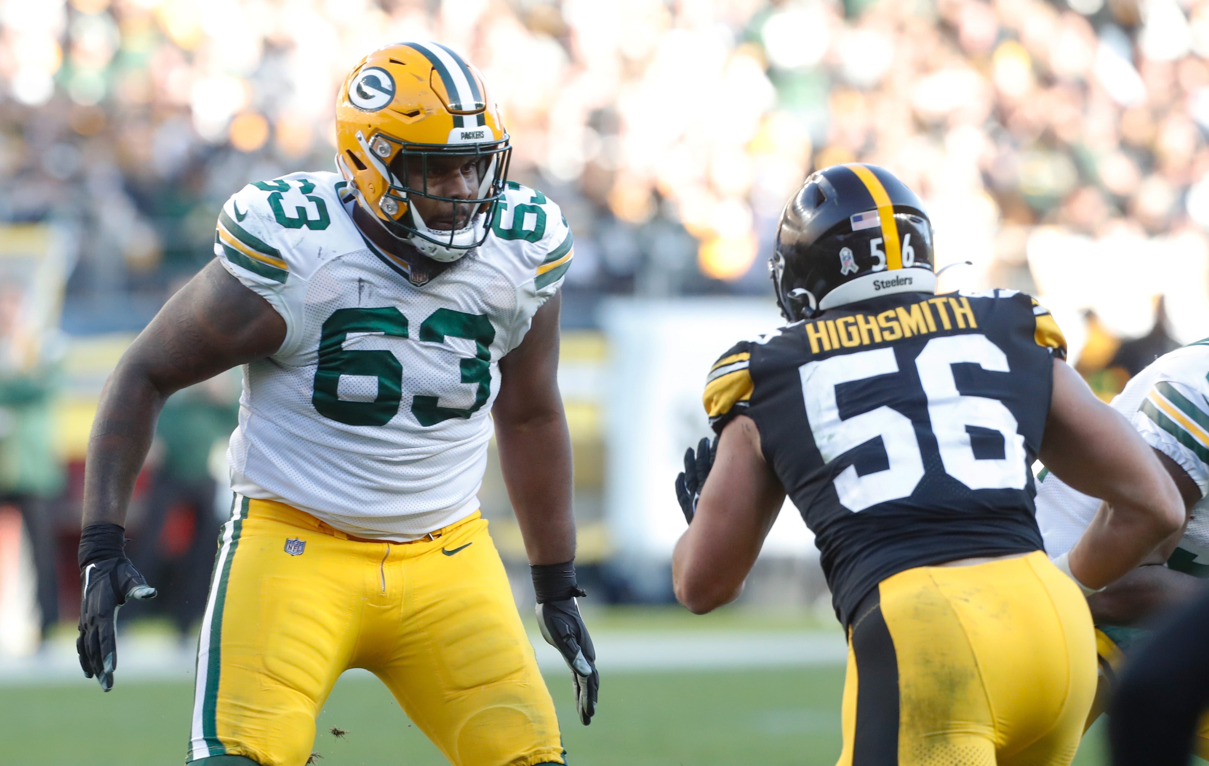 Green Bay Packers offensive tackle Rasheed Walker (63) blocks at the line of scrimmage against Pittsburgh Steelers linebacker Alex Highsmith (56)