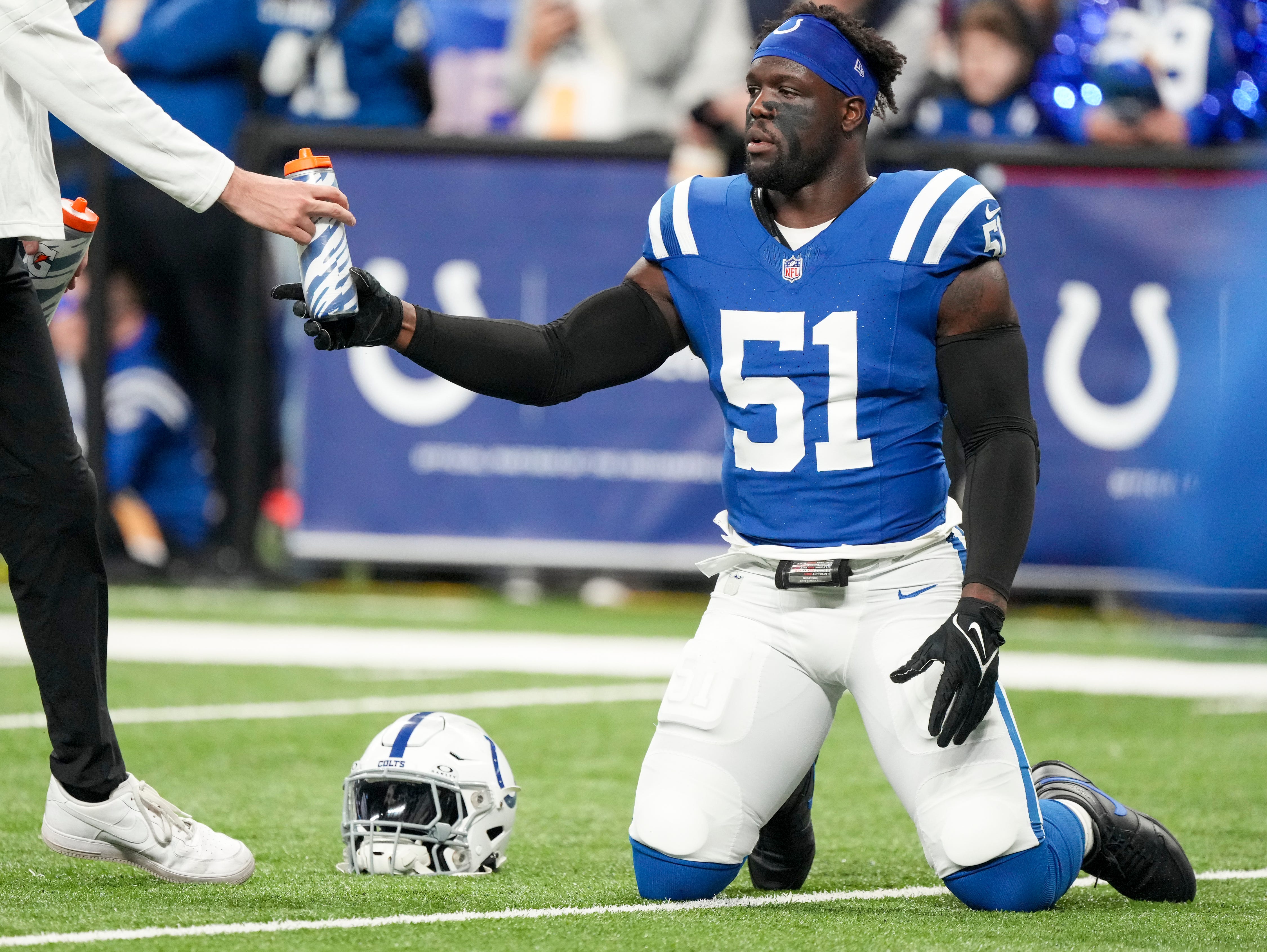 Indianapolis Colts defensive end Kwity Paye (51) has a drink of fluids during warmups, Las Vegas Raiders at Indianapolis Colts, Sunday, Dec. 31, 2023, at Lucas Oil Stadium.