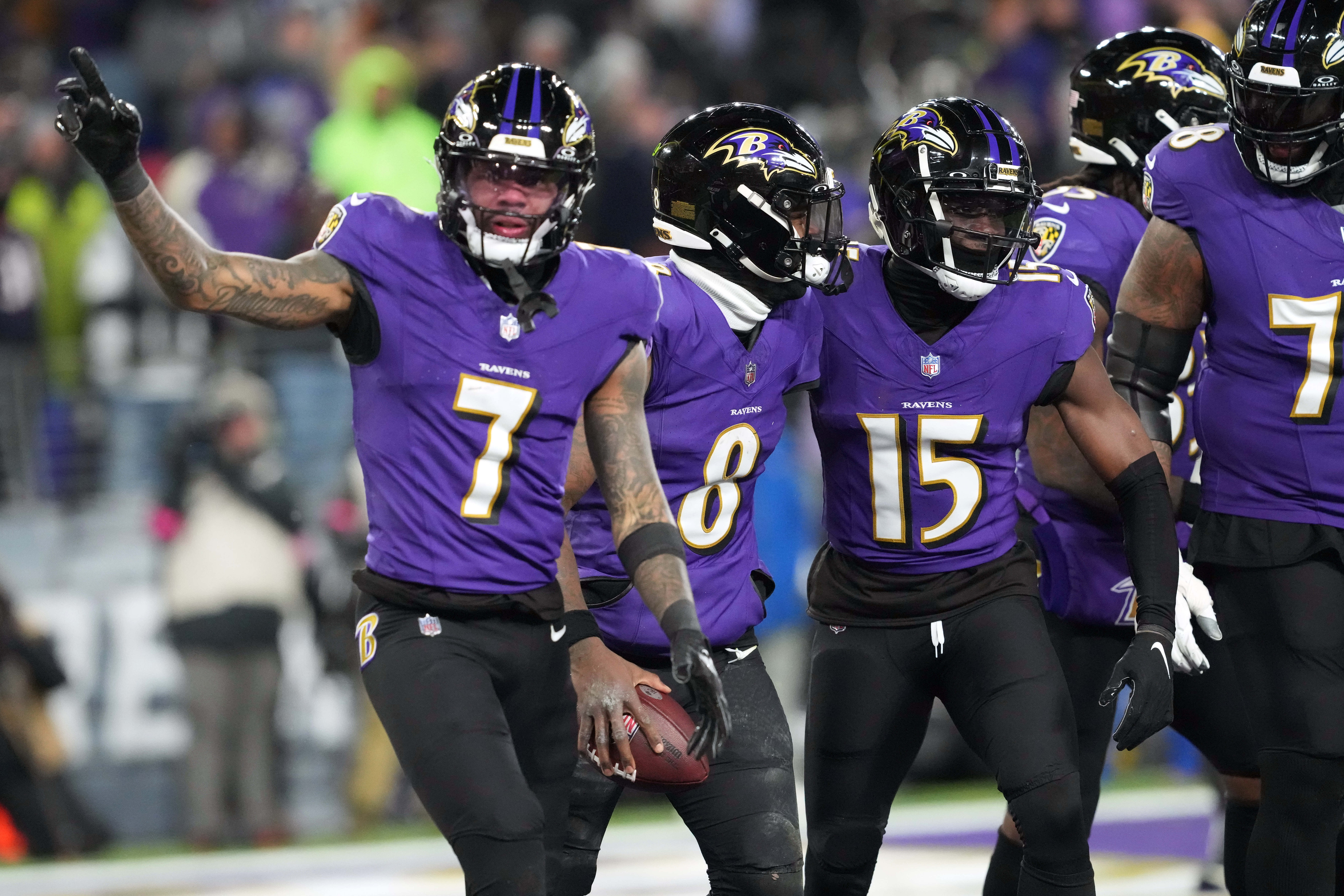Jan 20, 2024; Baltimore, MD, USA; Baltimore Ravens quarterback Lamar Jackson (8) celebrates with wide receiver Rashod Bateman (7) and wide receiver Nelson Agholor (15) after scoring a touchdown against the Houston Texans during the third quarter of a 2024 AFC divisional round game at M&T Bank Stadium. Mandatory Credit: Mitch Stringer-USA TODAY Sports