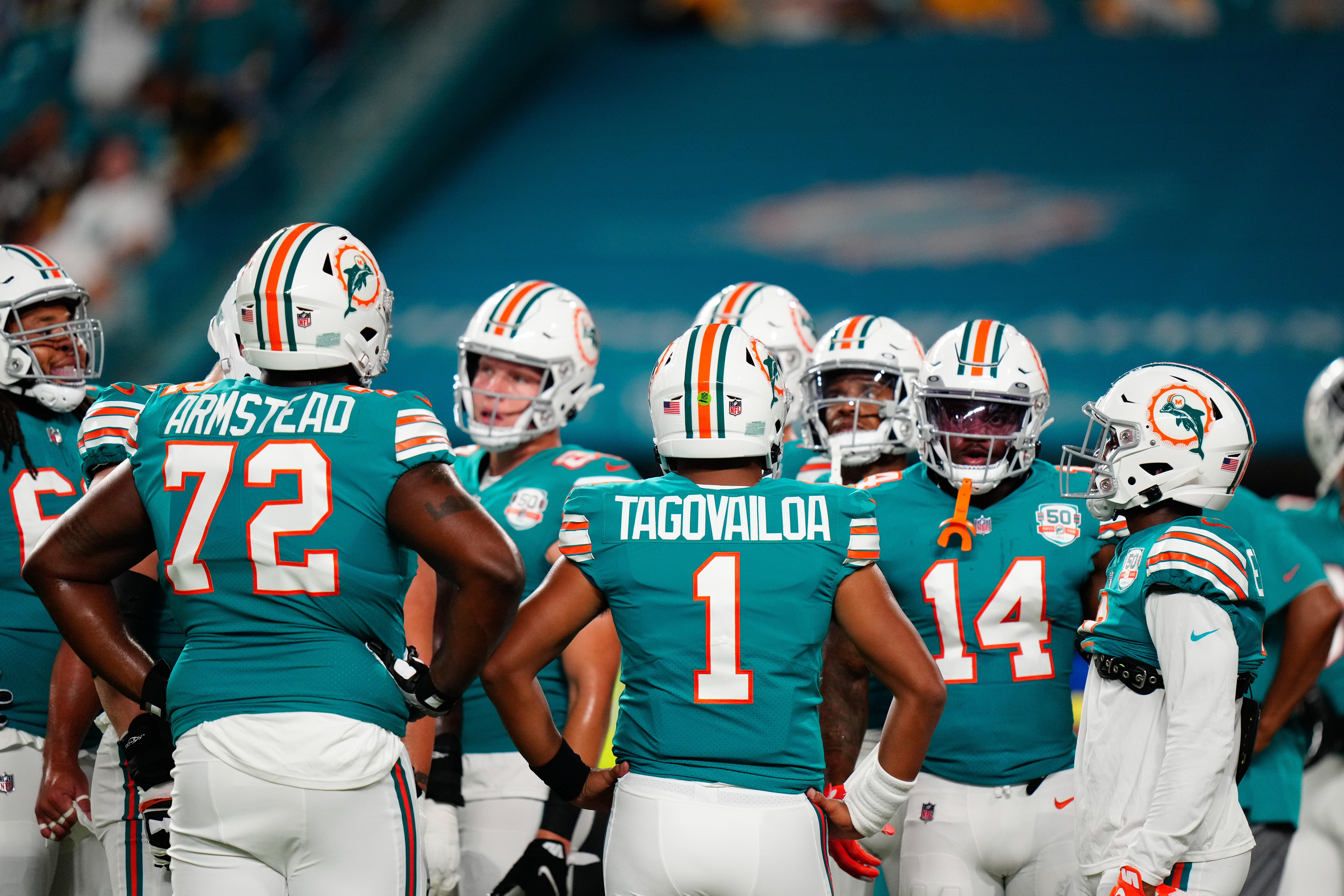 Oct 23, 2022; Miami Gardens, Florida, USA; Miami Dolphins offensive tackle Terron Armstead (72) and Miami Dolphins quarterback Tua Tagovailoa (1) talk to teammates prior to a game against the Pittsburgh Steelers at Hard Rock Stadium.
