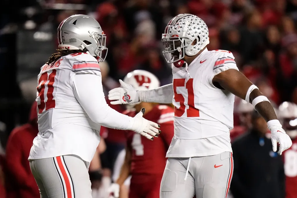Ohio State Buckeyes defensive tackle Michael Hall Jr. (51) celebrates with defensive tackle Tyleik Williams (91) during the second half of the NCAA football game against the Wisconsin Badgers.