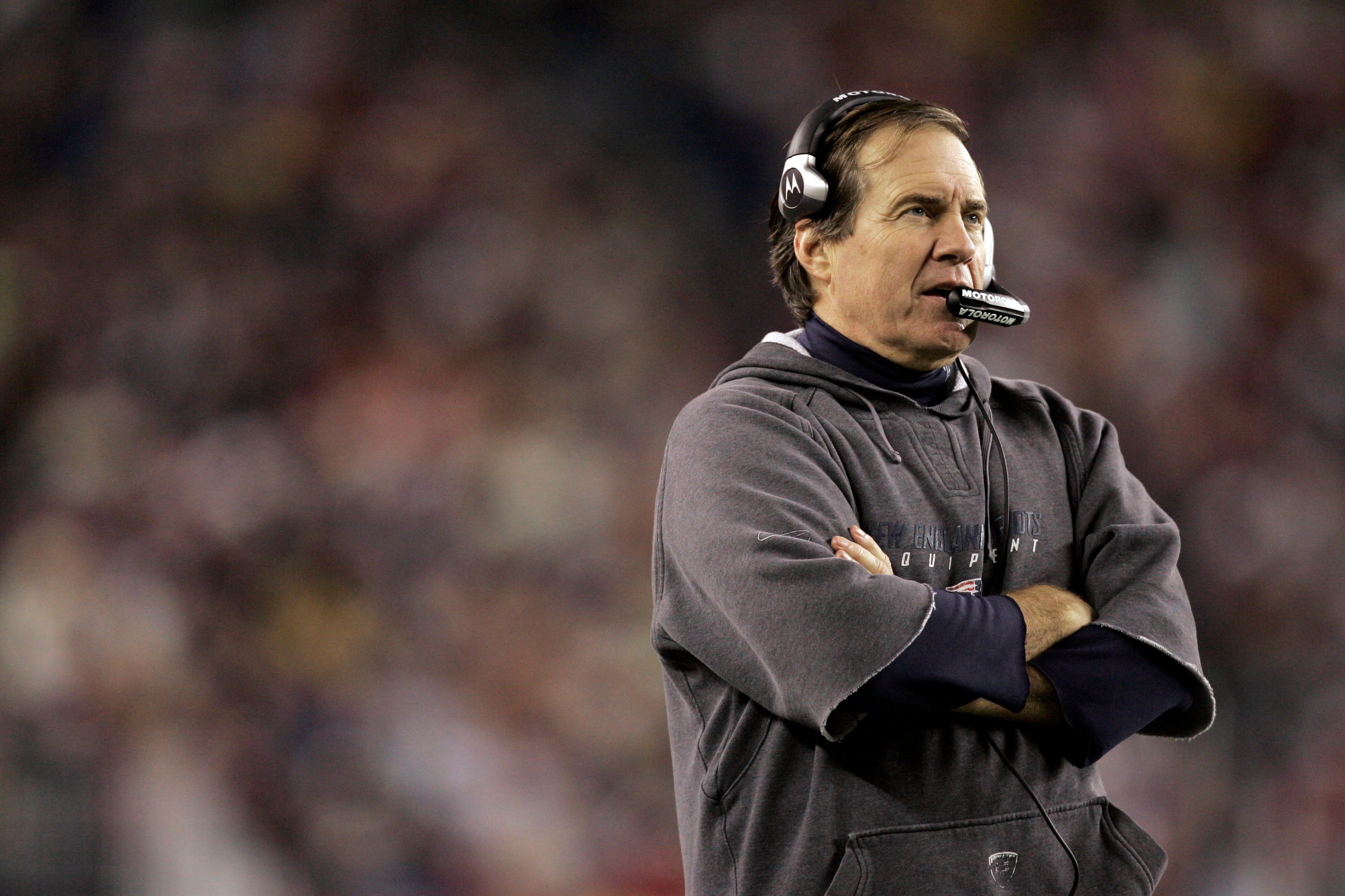 Dec 23, 2007; Foxborough, MA, USA; New England Patriots head coach Bill Belichick watches from the sideline against Miami Dolphins in the 3rd quarter at Gillette Stadium. The Patriots defeated Miami 28-7.