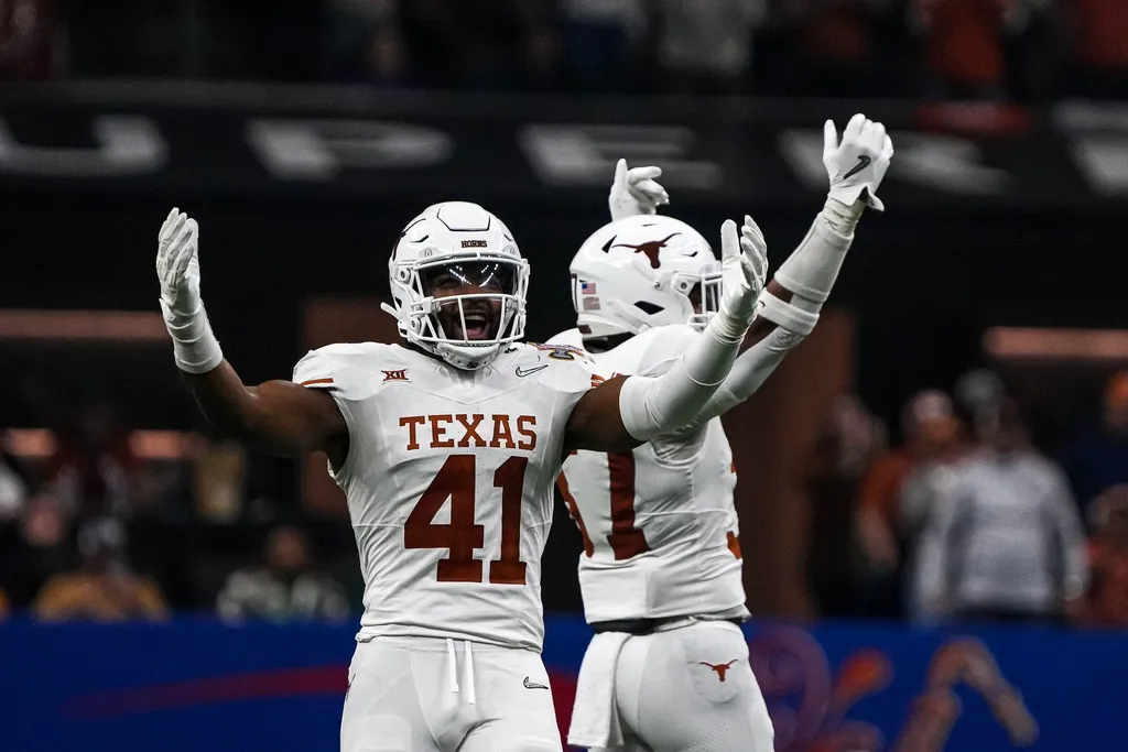 Texas Longhorns linebacker Jaylan Ford (41) celebrates a defensive stop during the Sugar Bowl College Football Playoff semifinals game against the Washington Huskies