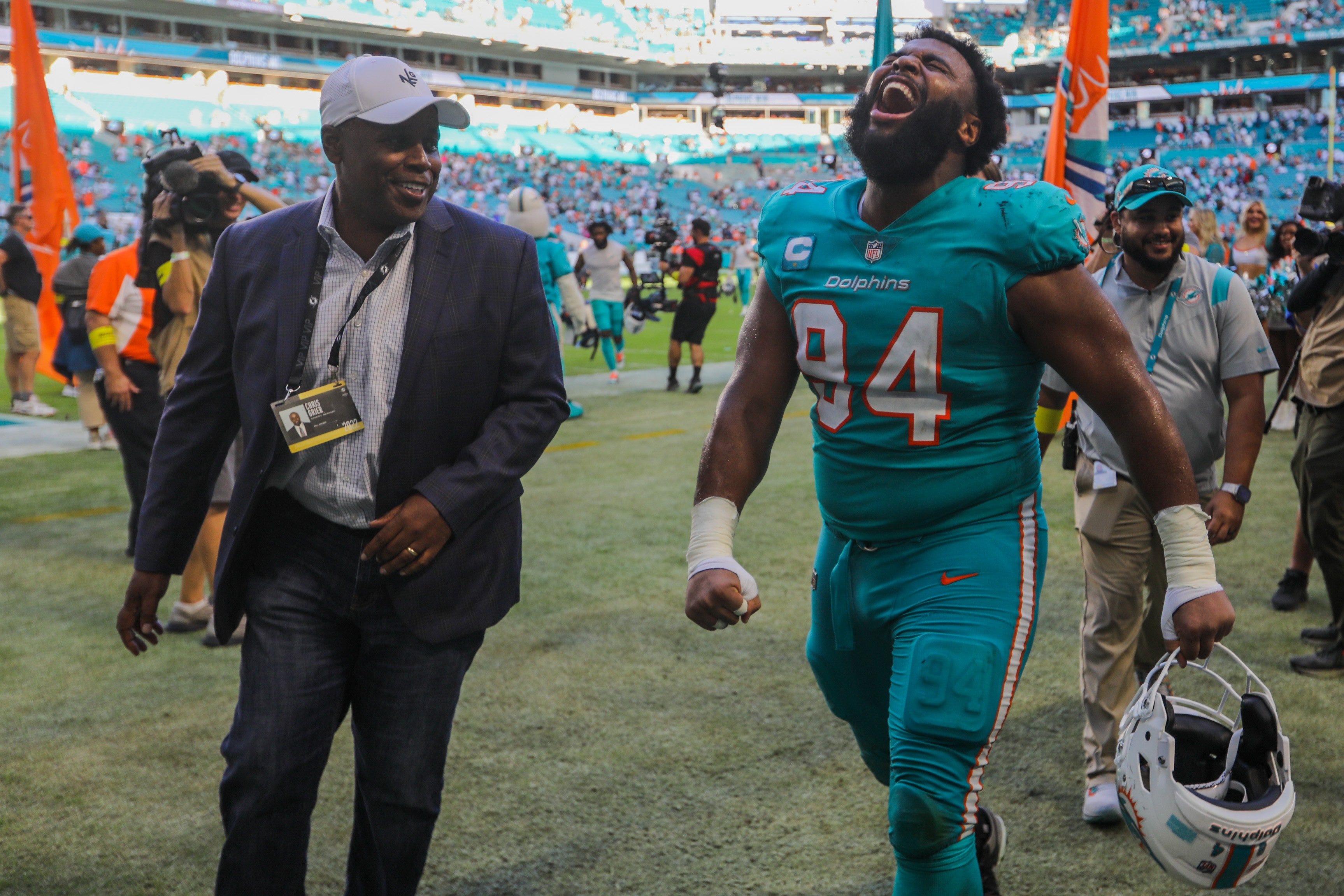 Miami Dolphins General Manager Chris Grier looks on as Miami Dolphins defensive tackle Christian Wilkins (94) celebrates