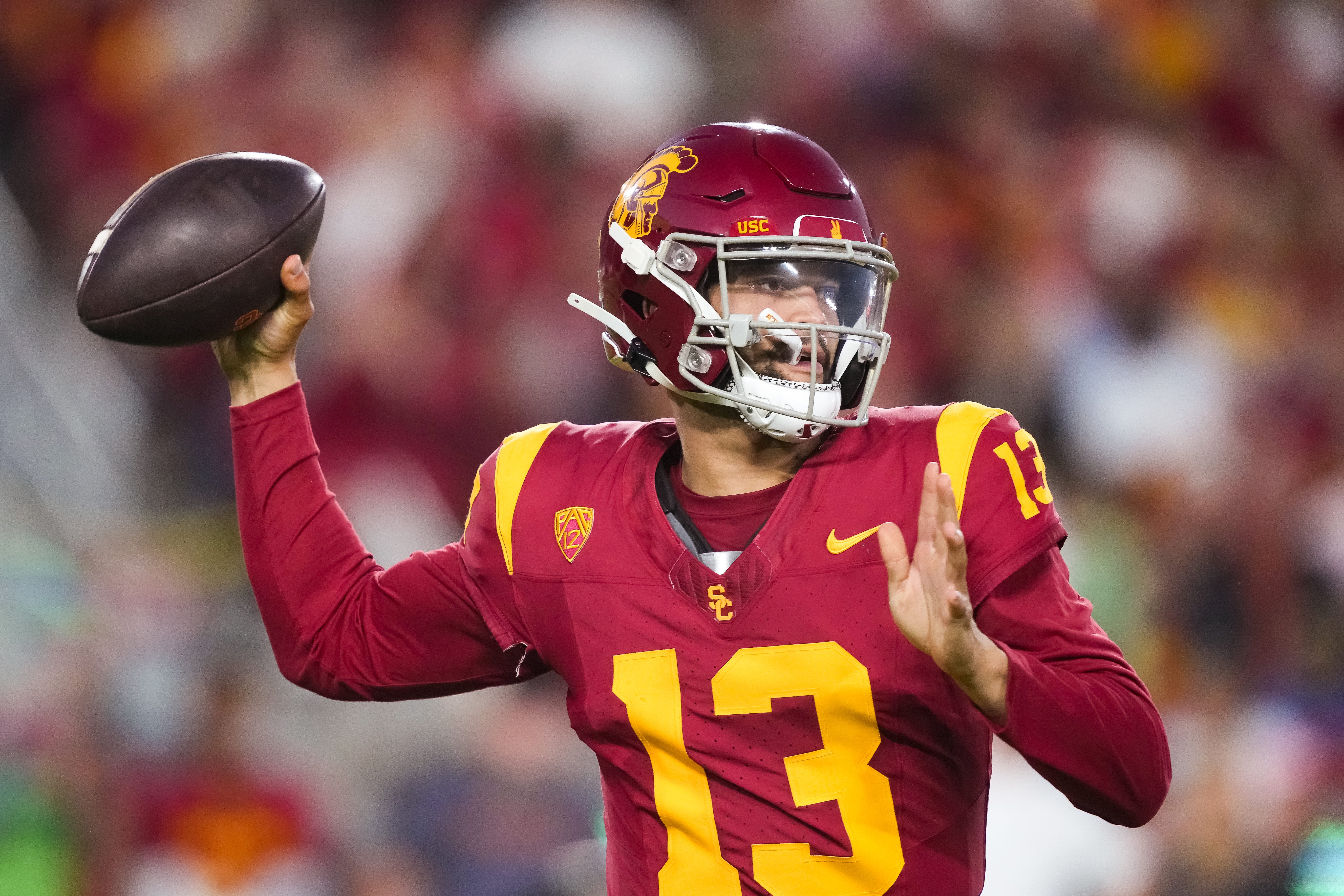 Oct 21, 2023; Los Angeles, California, USA; Southern California Trojans quarterback Caleb Williams (13) throws the ball against the Utah Utes in the second half at United Airlines Field at Los Angeles Memorial Coliseum.
