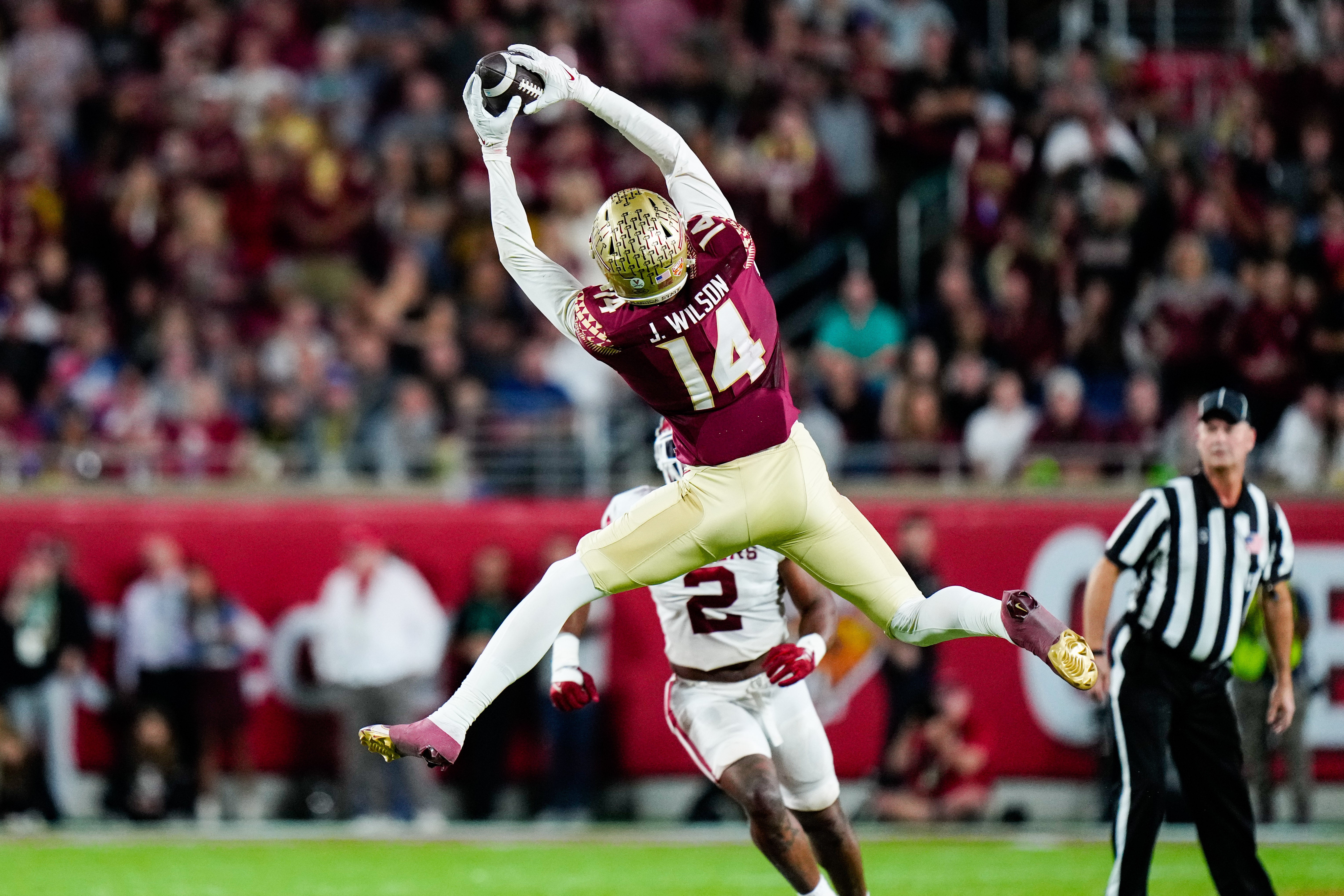 Dec 29, 2022; Orlando, Florida, USA; Florida State Seminoles wide receiver Johnny Wilson (14) catches a pass against the Oklahoma Sooners during the second half in the 2022 Cheez-It Bowl at Camping World Stadium.