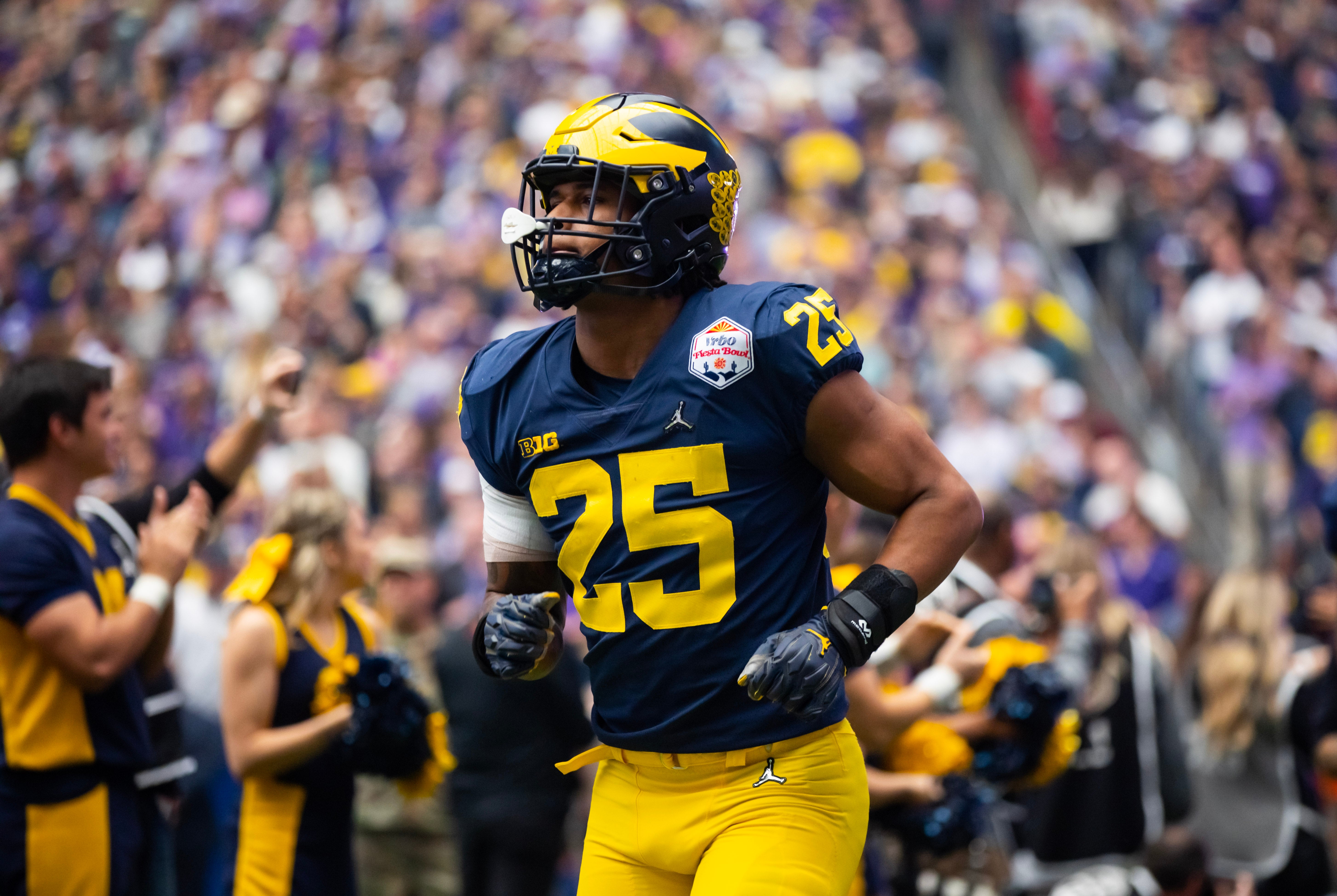 Dec 31, 2022; Glendale, Arizona, USA; Michigan Wolverines linebacker Junior Colson (25) against the TCU Horned Frogs during the 2022 Fiesta Bowl at State Farm Stadium.
