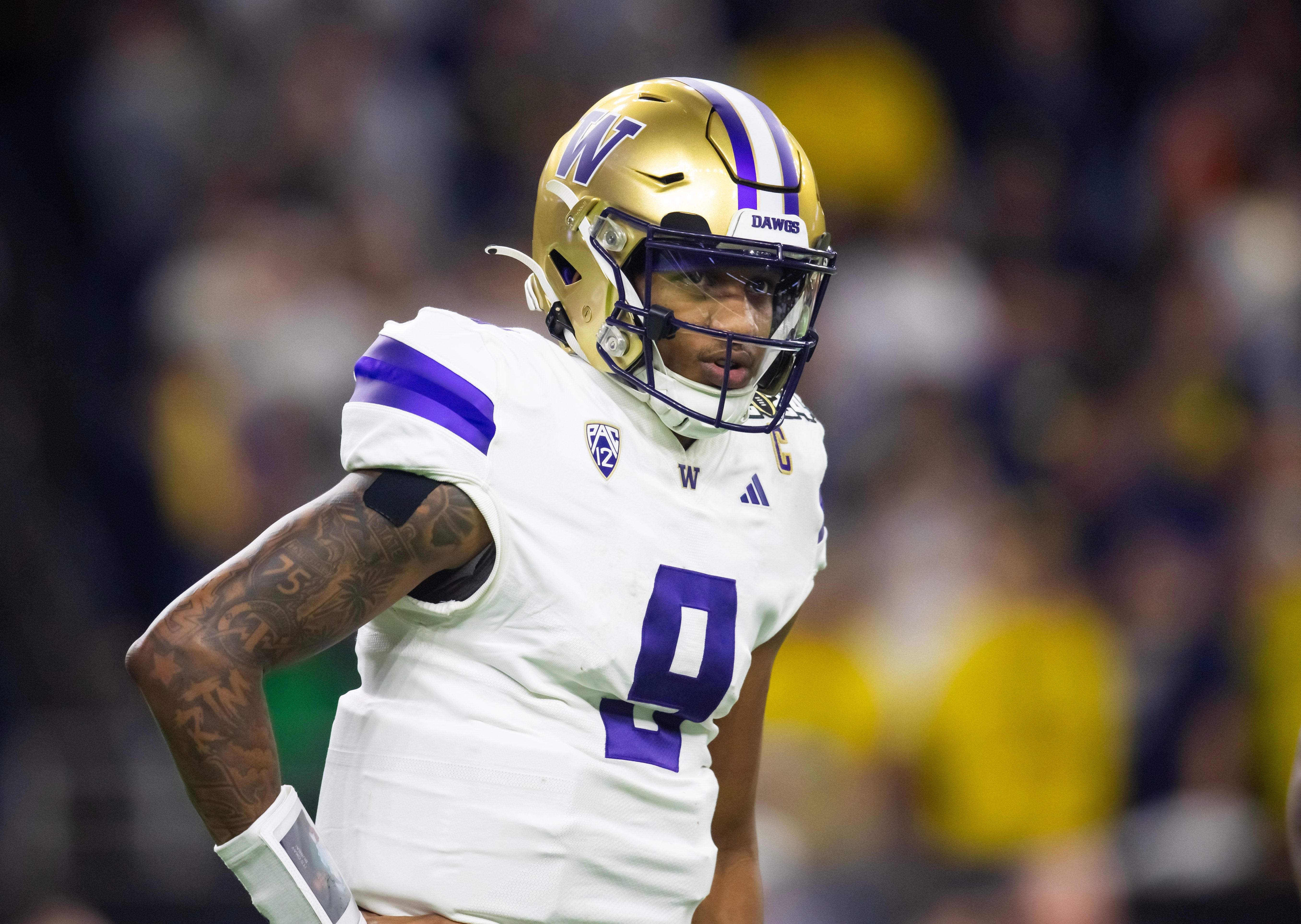 Washington Huskies quarterback Michael Penix Jr. (9) against the Michigan Wolverines