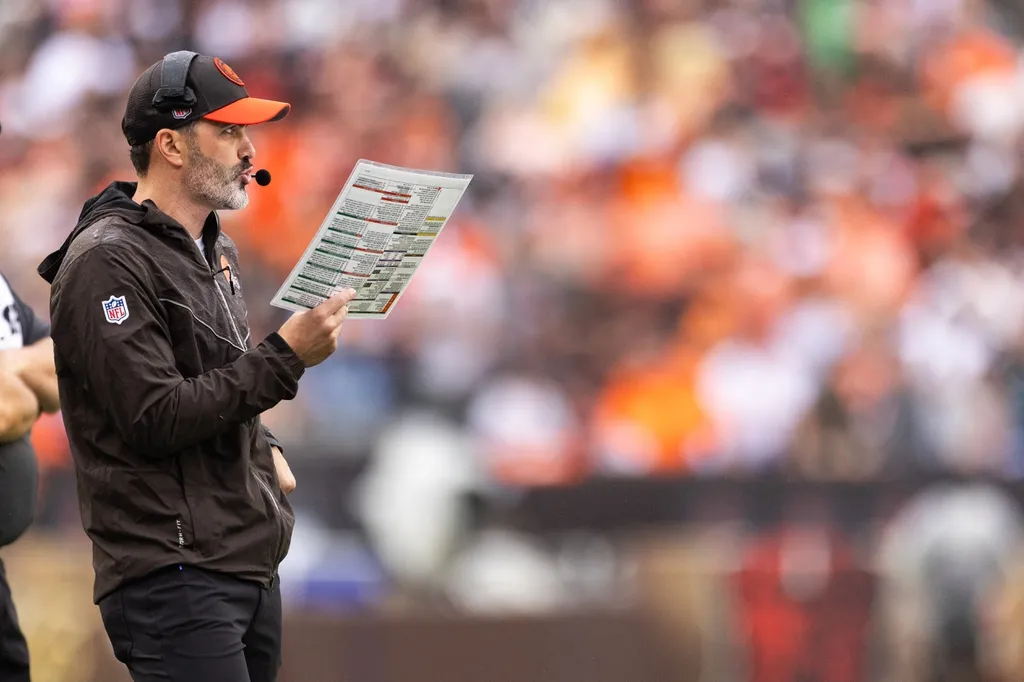 Cleveland Browns head coach Kevin Stefanski speaks into his headset during the second quarter against the Cincinnati Bengals at Cleveland Browns Stadium.
