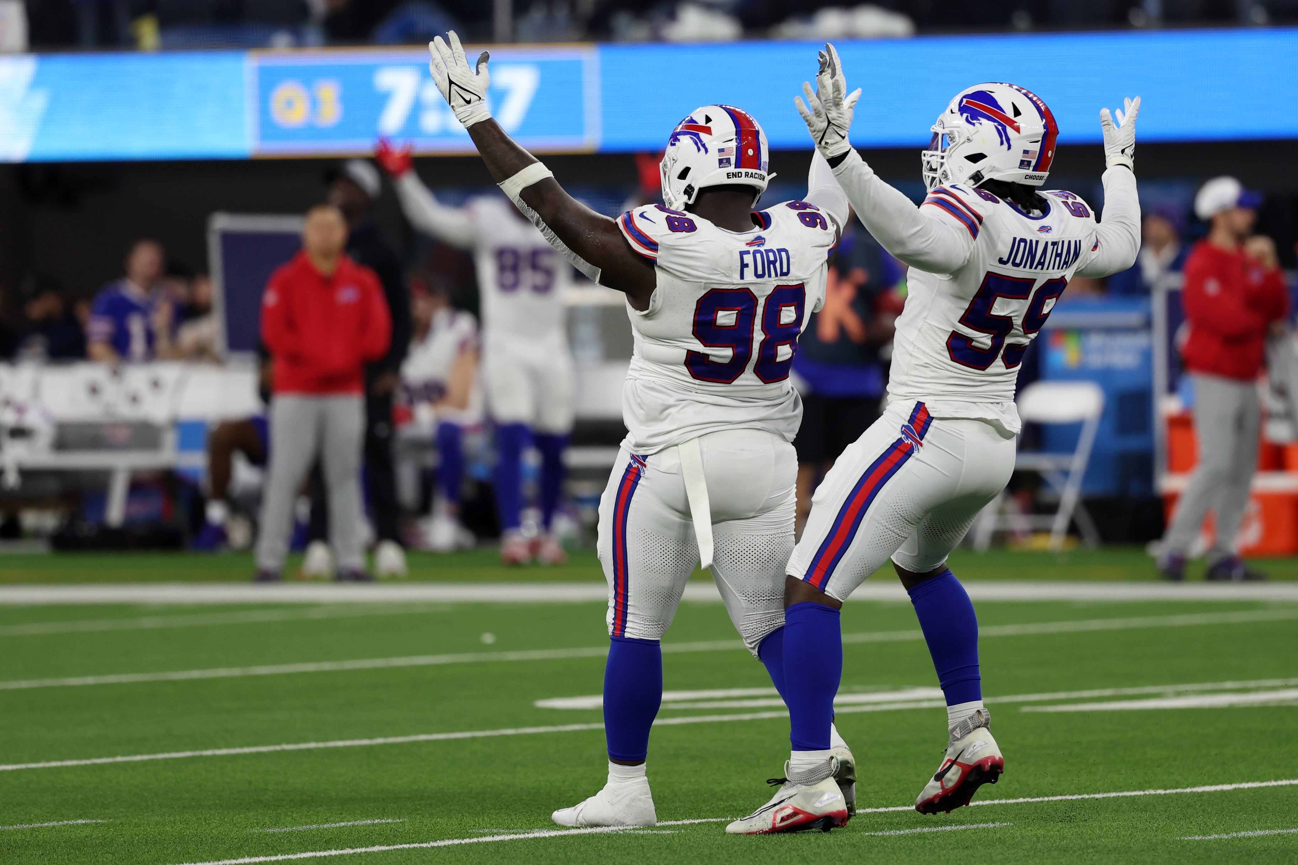 Dec 23, 2023; Inglewood, California, USA; Buffalo Bills defensive tackle Poona Ford (98) celebrates with defensive end Kingsley Jonathan (59) after making a quarterback sack during the third quarter against the Los Angeles Chargers at SoFi Stadium.