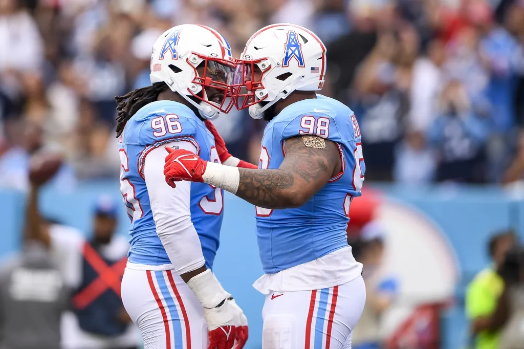 Tennessee Titans defensive tackle Jeffery Simmons (98) and defensive end Denico Autry (96) celebrate the sack against the Atlanta Falcons during the first half at Nissan Stadium.