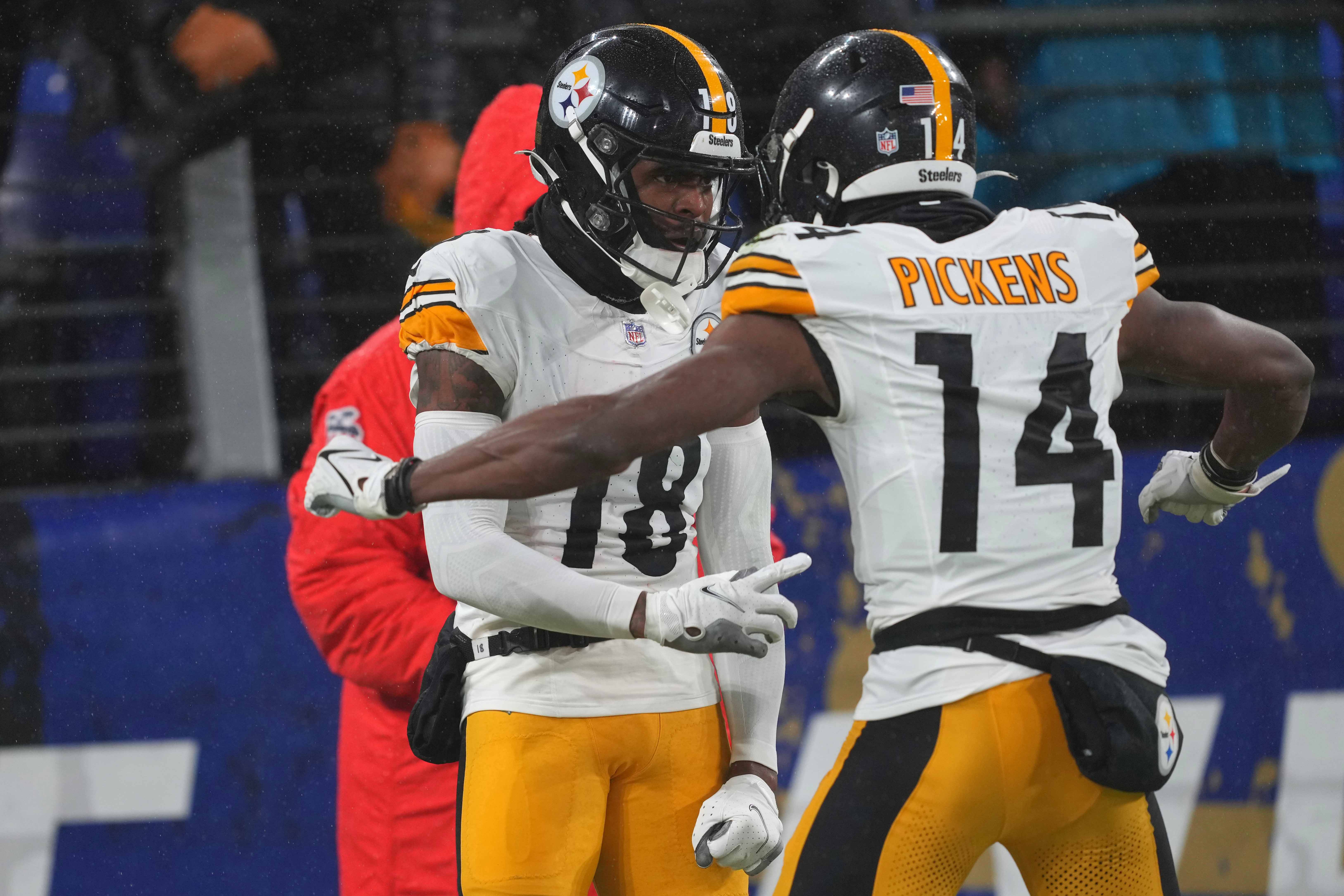Jan 6, 2024; Baltimore, Maryland, USA; Pittsburgh Steelers wide receiver Deontae Johnson (18) celebrates his fourth quarter touchdown against the Baltimore Ravens with wide receiver George Pickens (14) at M&T Bank Stadium. Mandatory Credit: Mitch Stringer-USA TODAY Sports  