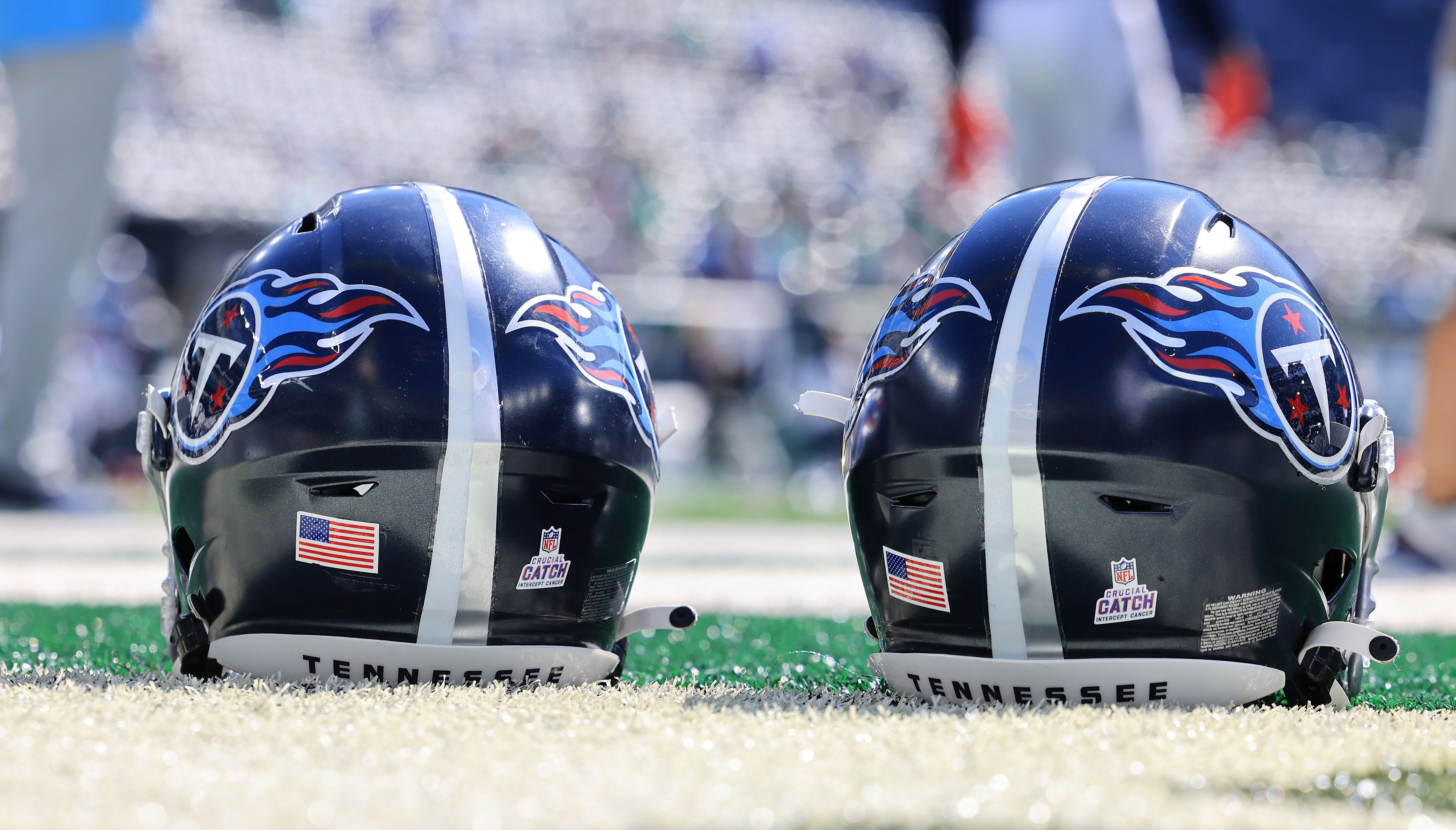 Tennessee Titans helmets rest on the field before the game between the New York Jets and the Titans at MetLife Stadium. Vincent Carchietta-USA TODAY Sports