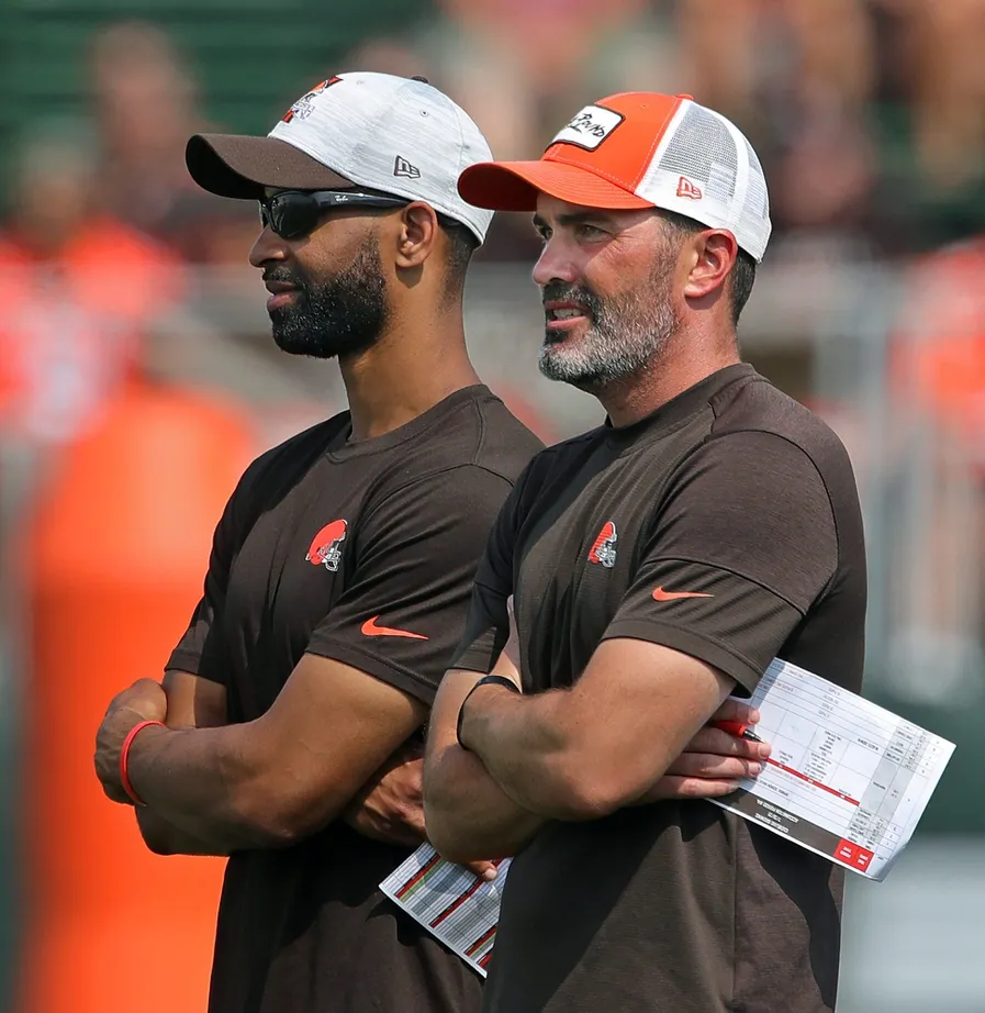 Cleveland Browns GM Andrew Berry, left, and head coach Kevin Stefanski watch the team practice during NFL football training camp, Saturday, July 31, 2021, in Berea, Ohio. Brownscamp31