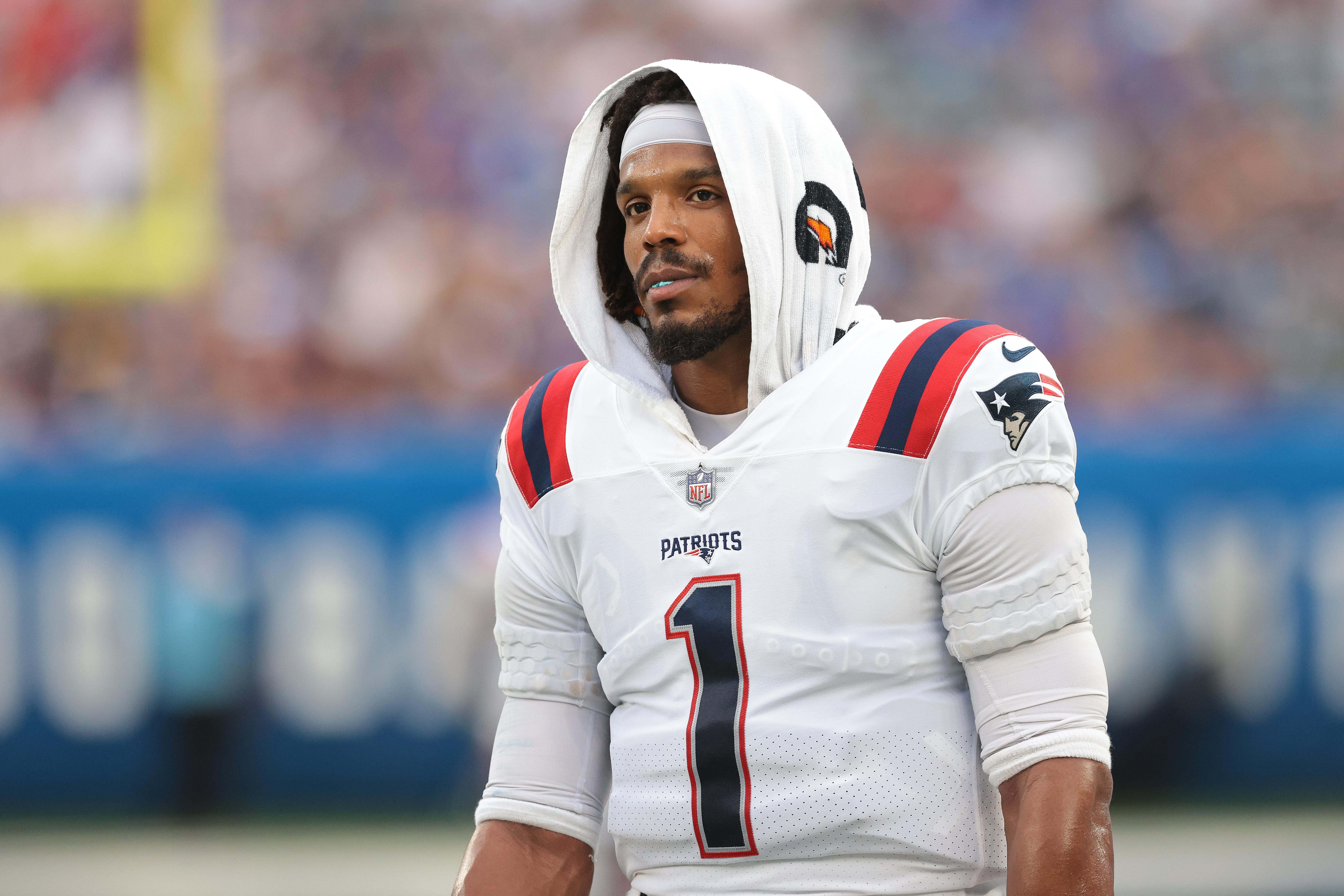 Aug 29, 2021; East Rutherford, New Jersey, USA; New England Patriots quarterback Cam Newton (1) looks on during the first half against the New York Giants at MetLife Stadium.