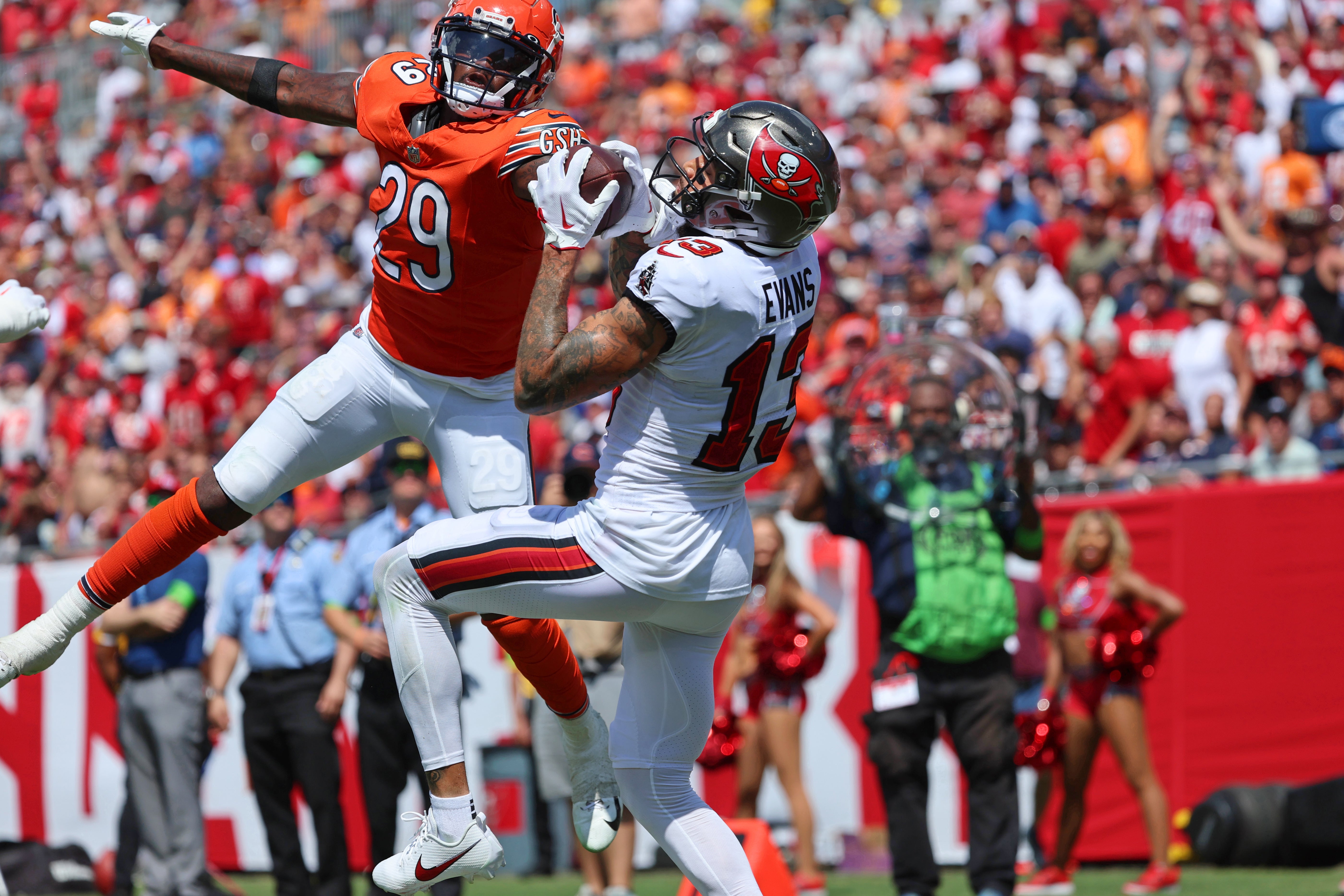 Sep 17, 2023; Tampa, Florida, USA; Tampa Bay Buccaneers wide receiver Mike Evans (13) catches a touchdown over Chicago Bears cornerback Tyrique Stevenson (29) during the second half at Raymond James Stadium.