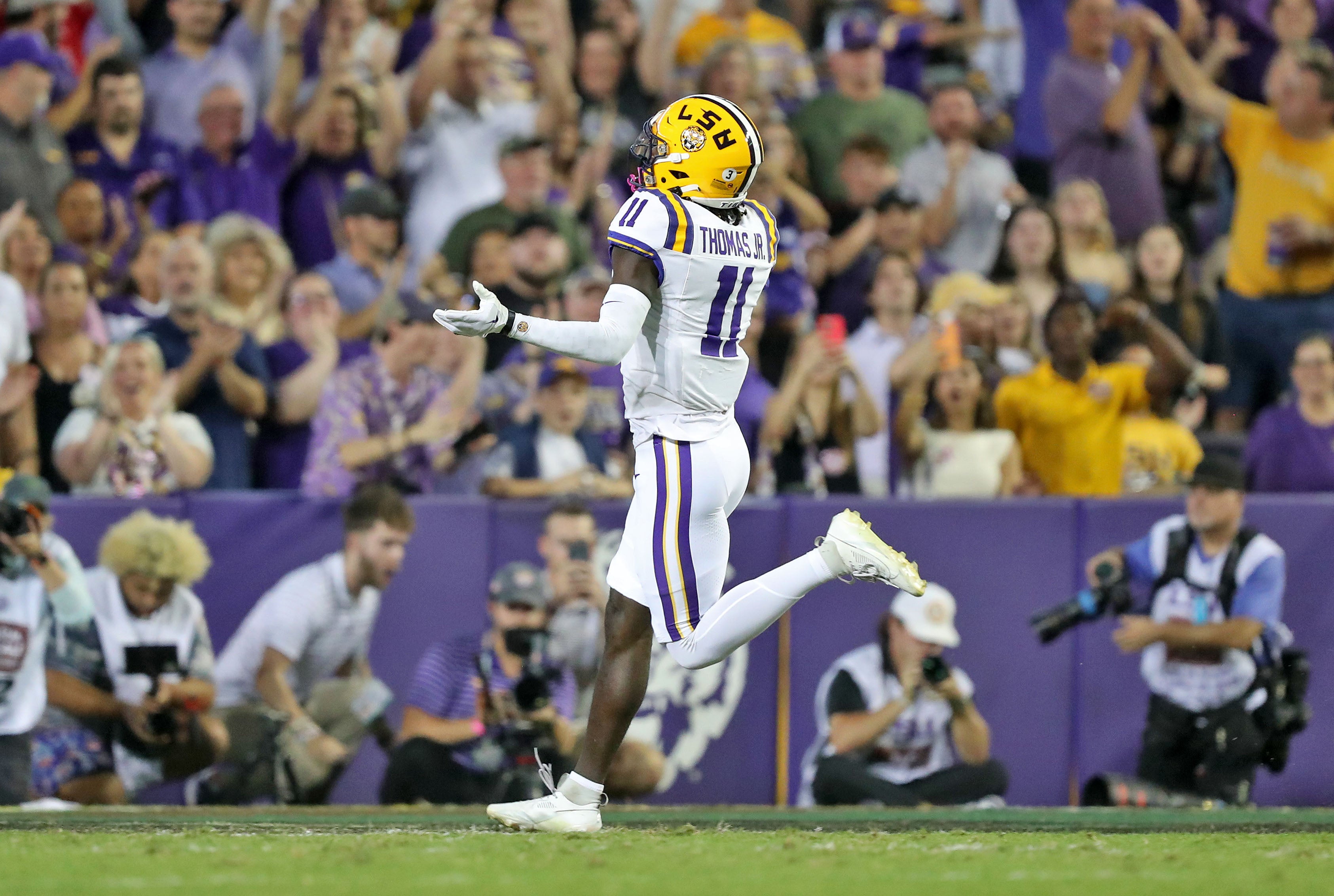 Oct 21, 2023; Baton Rouge, Louisiana, USA; LSU Tigers wide receiver Brian Thomas Jr. (11) celebrates his touchdown against the Army Black Knights during the first half at Tiger Stadium.