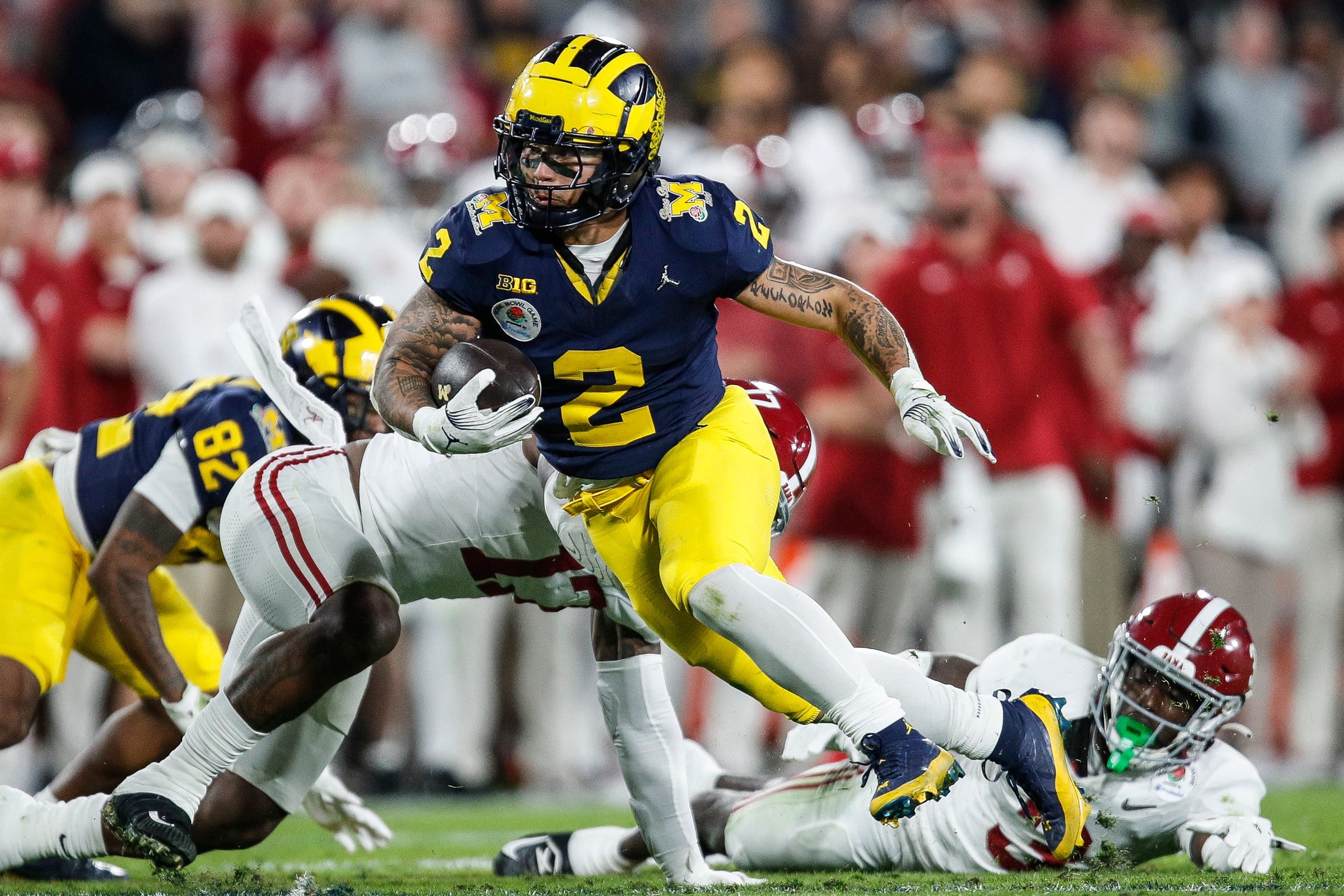 Michigan running back Blake Corum (2) runs against Alabama during the second half of their College Football Playoff semifinal game at the 2024 Rose Bowl in Pasadena, Calif.