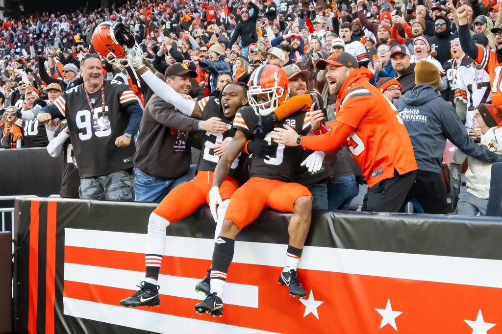 Cleveland Browns cornerback Martin Emerson Jr. (23) and cornerback Greg Newsome II (0) celebrate with fans after the Browns beat the Pittsburgh Steelers at Cleveland Browns Stadium.