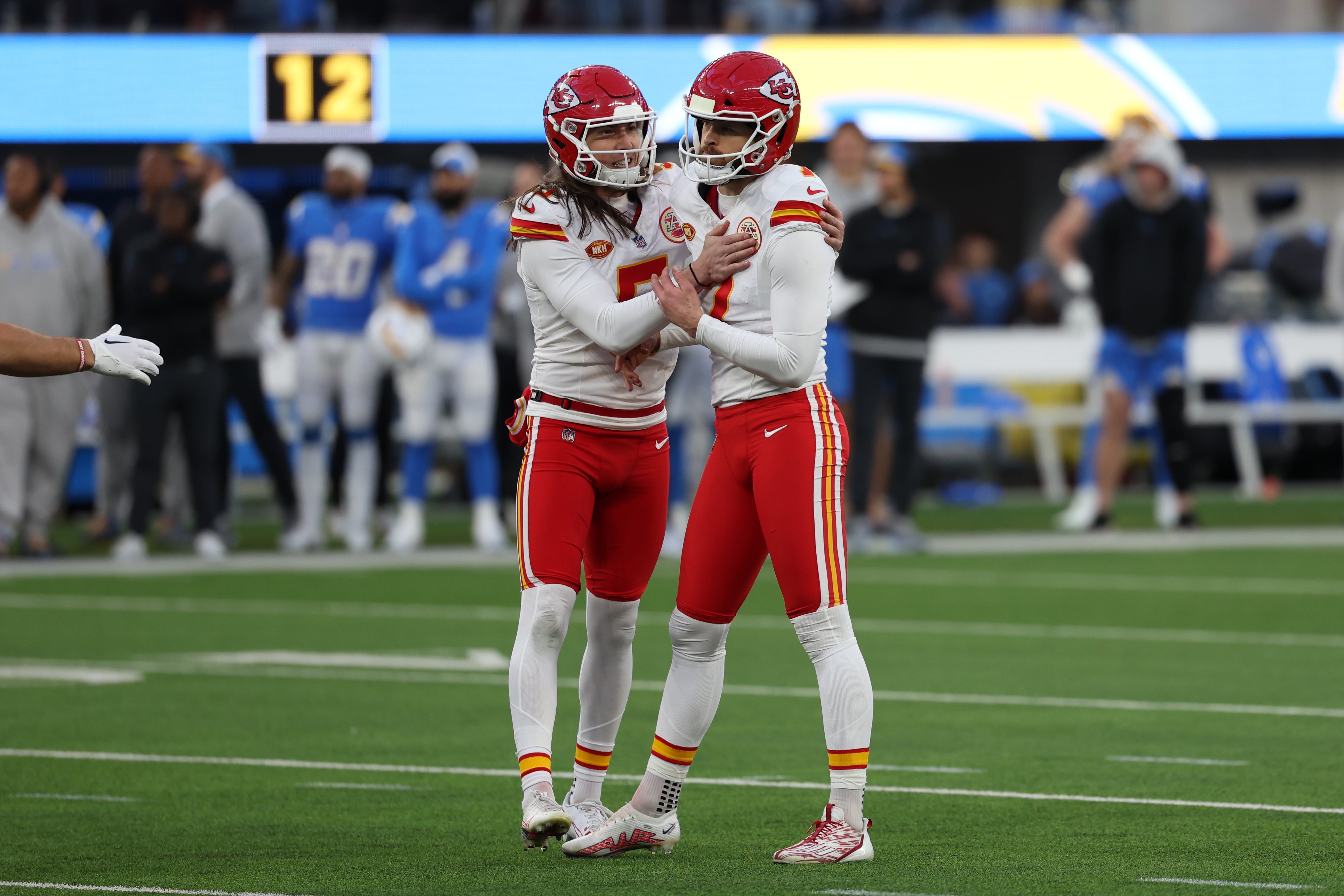 Jan 7, 2024; Inglewood, California, USA; Kansas City Chiefs place kicker Harrison Butker (7, right) celebrates with punter Tommy Townsend (5, left) after making the game winning field goal during the fourth quarter against the Los Angeles Chargers at SoFi Stadium. Mandatory Credit: Kiyoshi Mio-USA TODAY Sports