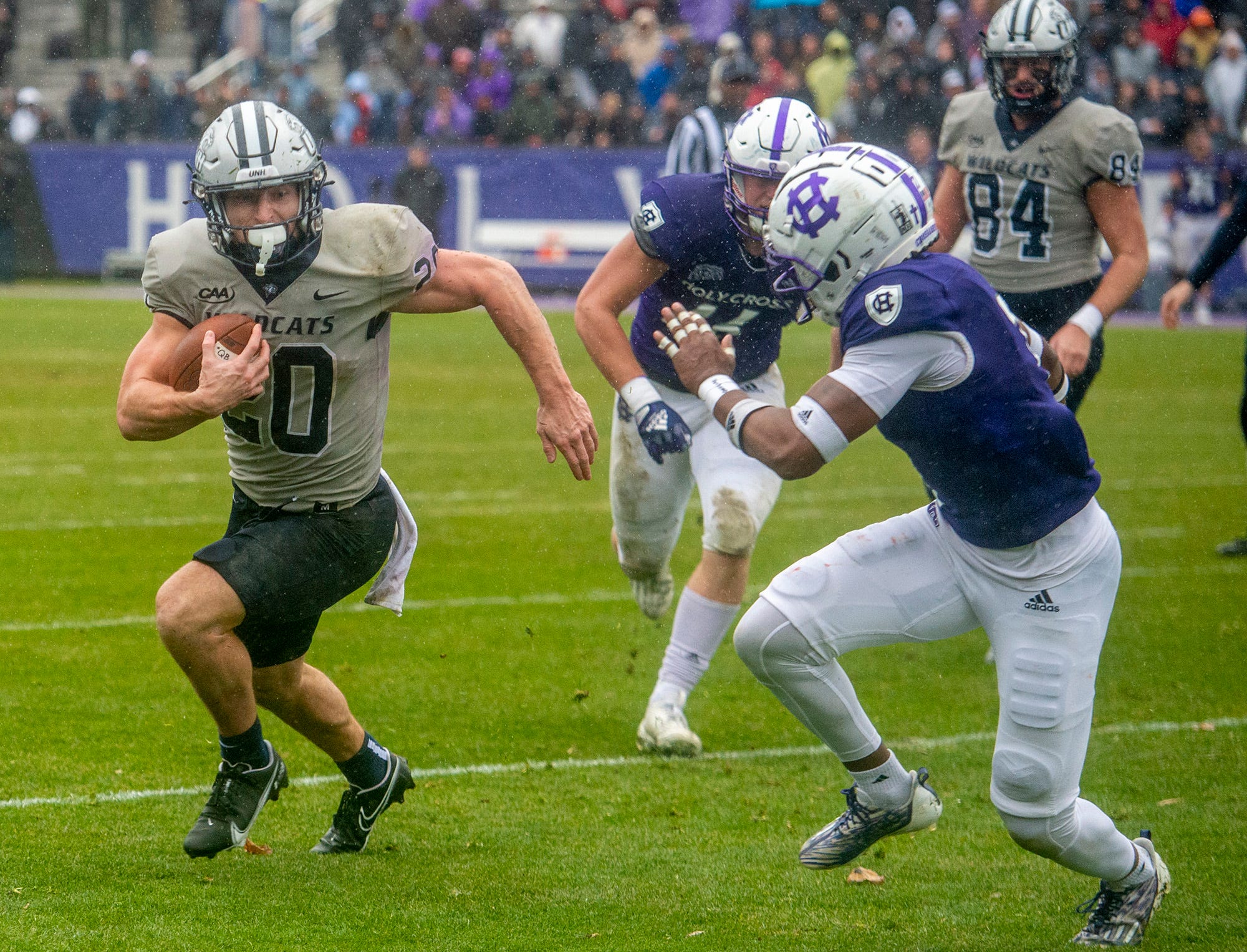 University of New Hampshire junior Dylan Laube runs against Holy Cross in the second round of the FCS playoffs, Dec. 3, 2022 in Worcester.