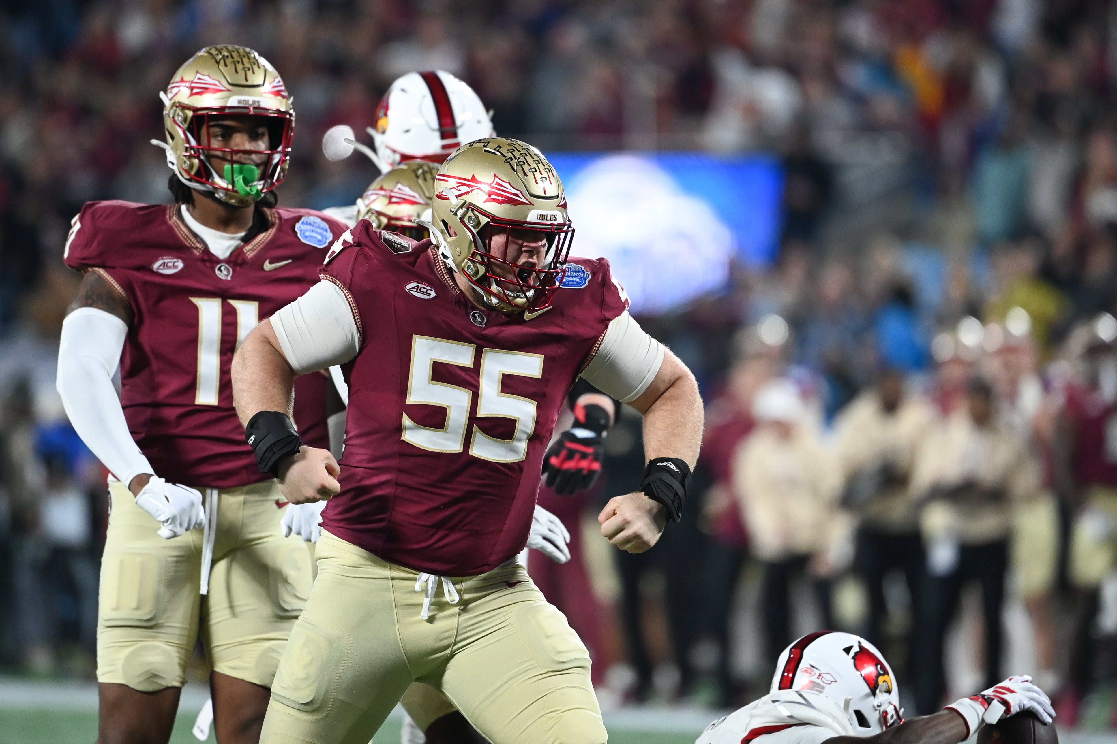 Dec 2, 2023; Charlotte, NC, USA; Florida State Seminoles defensive lineman Braden Fiske (55) reacts after a tackle on Louisville Cardinals running back Jawhar Jordan (25) in the first quarter at Bank of America Stadium.