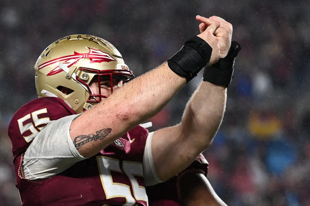 Florida State Seminoles defensive lineman Braden Fiske (55) gestures to his ring finger after sacking Louisville Cardinals quarterback Jack Plummer (not pictured) in the fourth quarter.