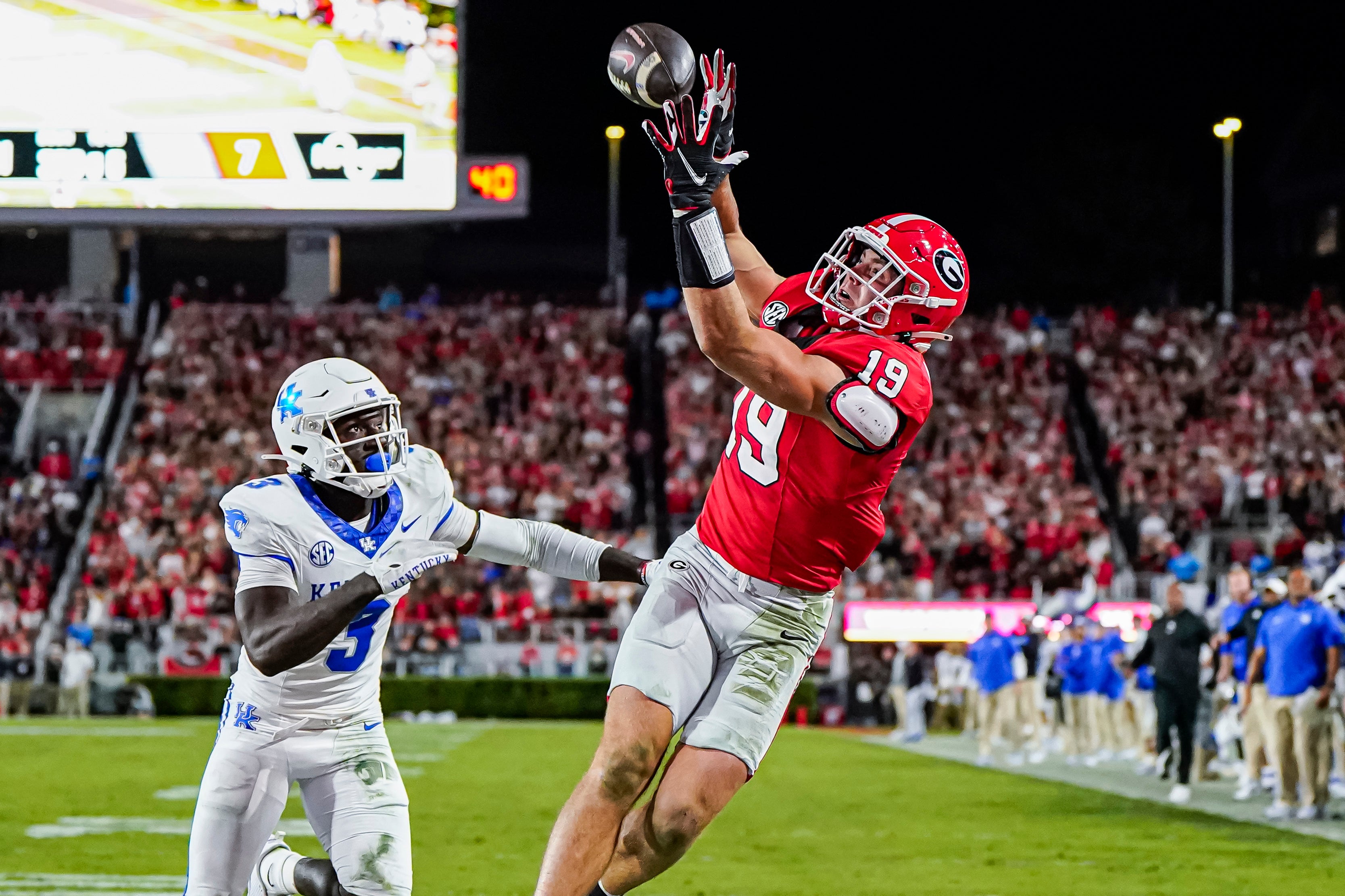 Oct 7, 2023; Athens, Georgia, USA; Georgia Bulldogs tight end Brock Bowers (19) can t hold a pass behind Kentucky Wildcats defensive back Alex Afari Jr. (3) at Sanford Stadium.