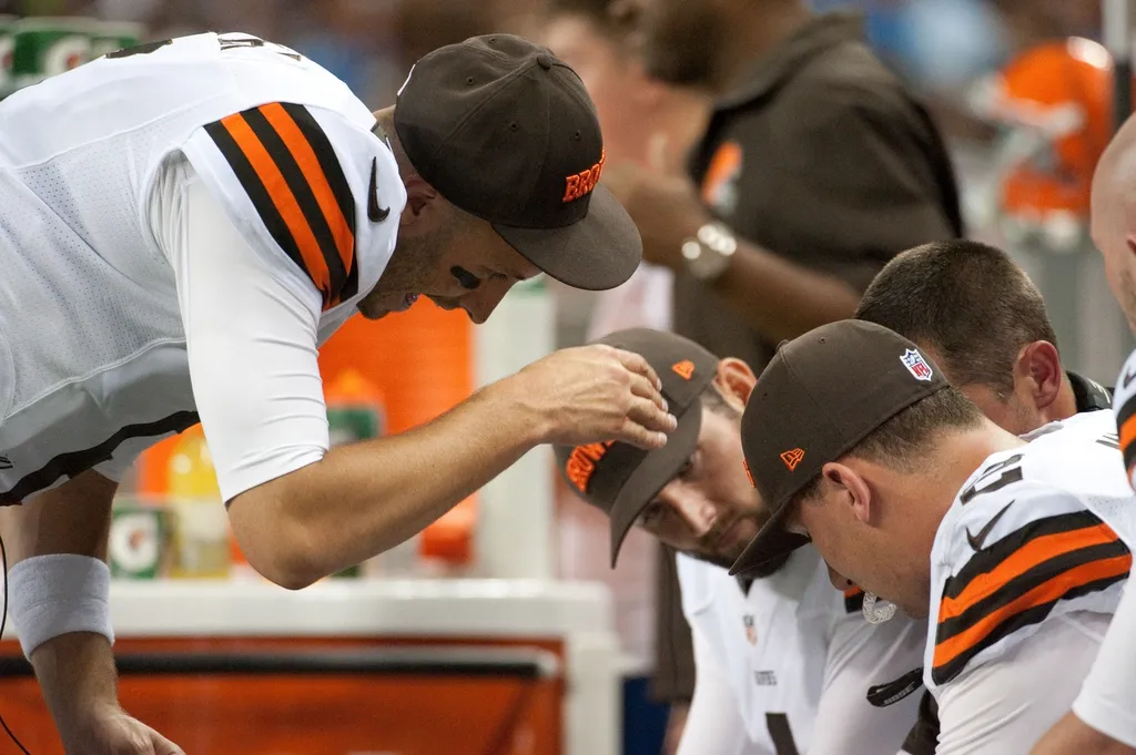 Cleveland Browns quarterback Brian Hoyer (6) talks to quarterback Johnny Manziel (2) during the third quarter against the Detroit Lions at Ford Field.
